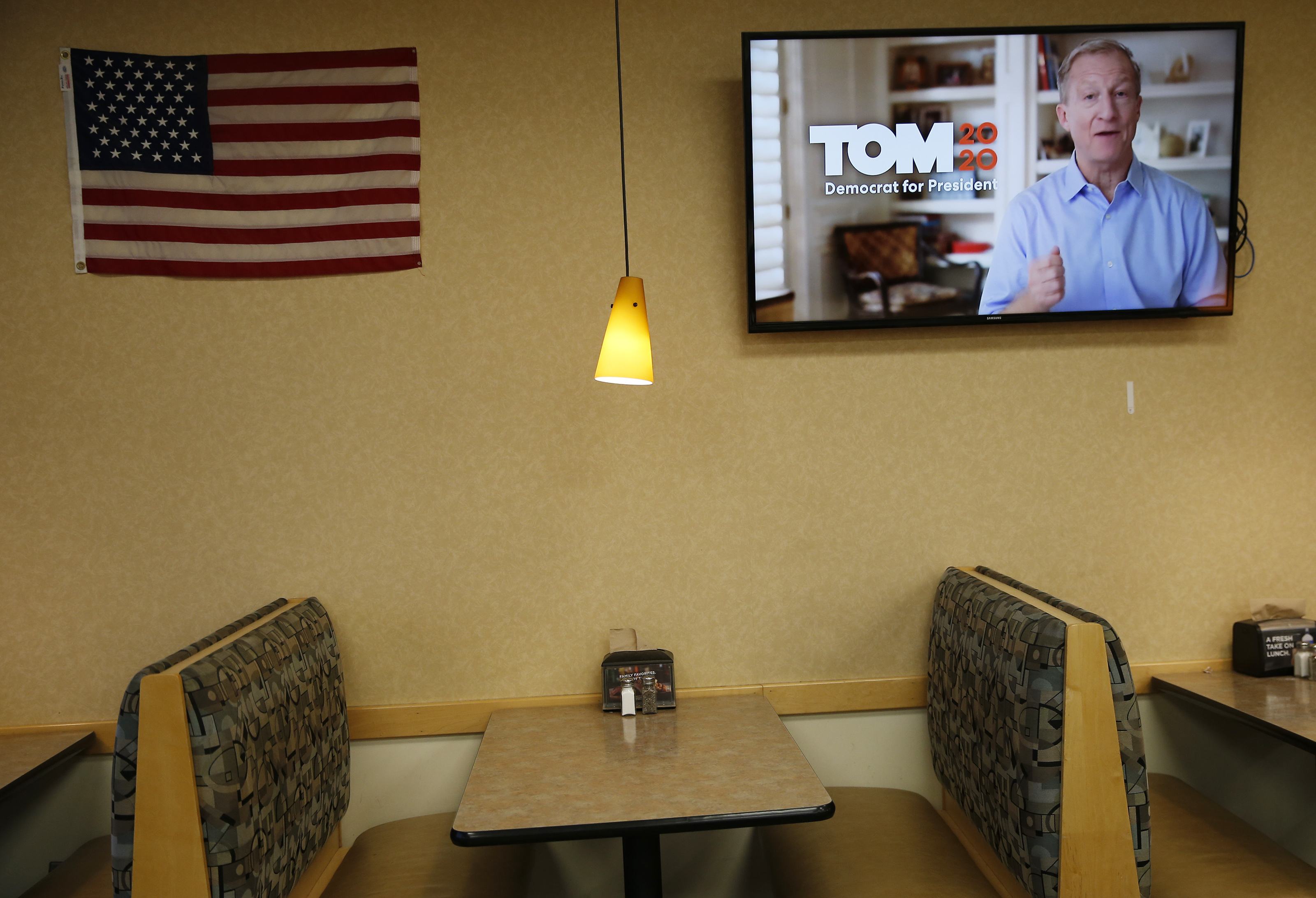 An advertisement for Tom Steyer played inside the Hy-Vee grocery store.
