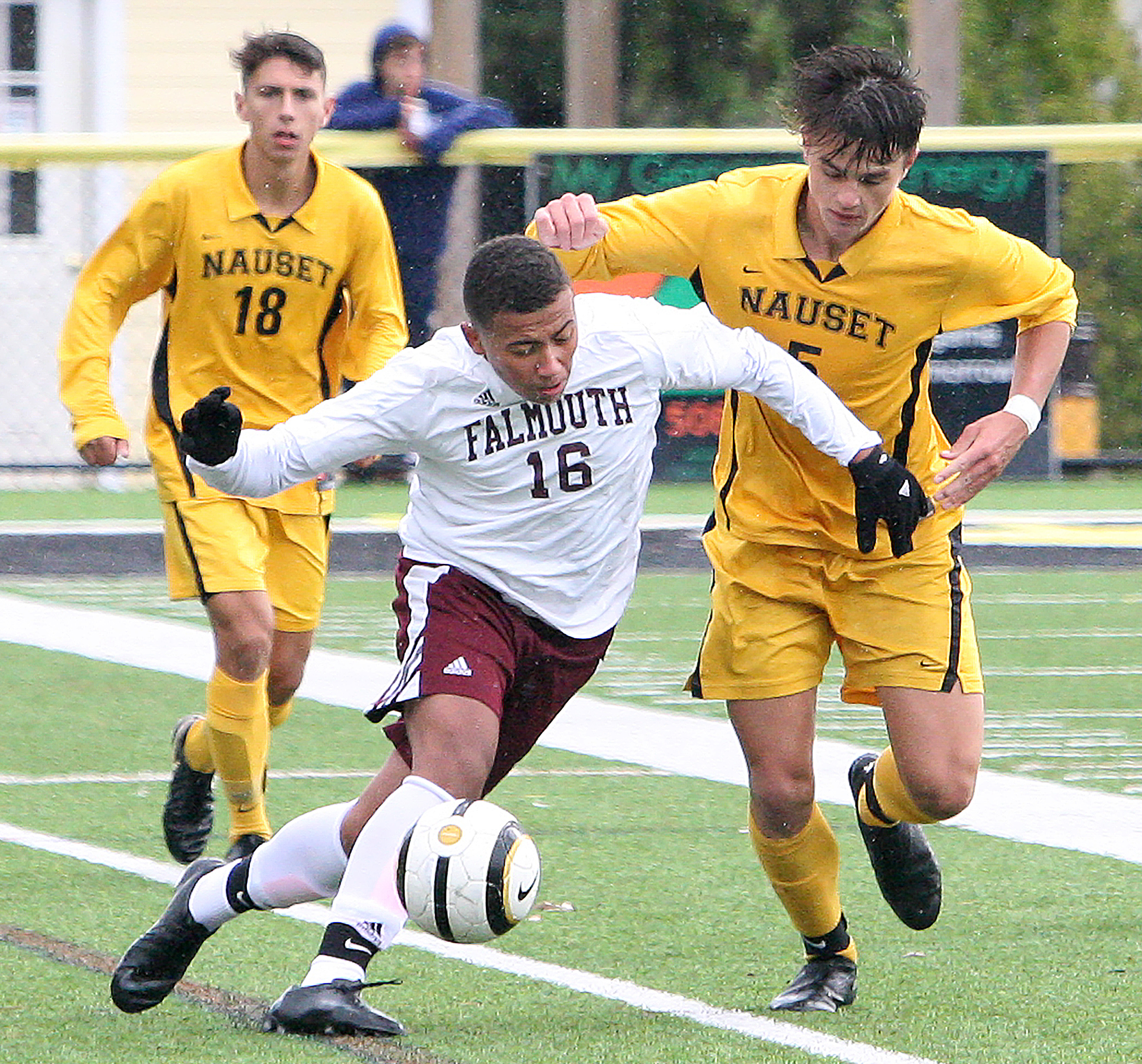 Falmouth’s Coleby Andrade (16) found it difficult navigating Nauset’s defense led by Nolan Ellard (18) and Sebastian Headrick (5).