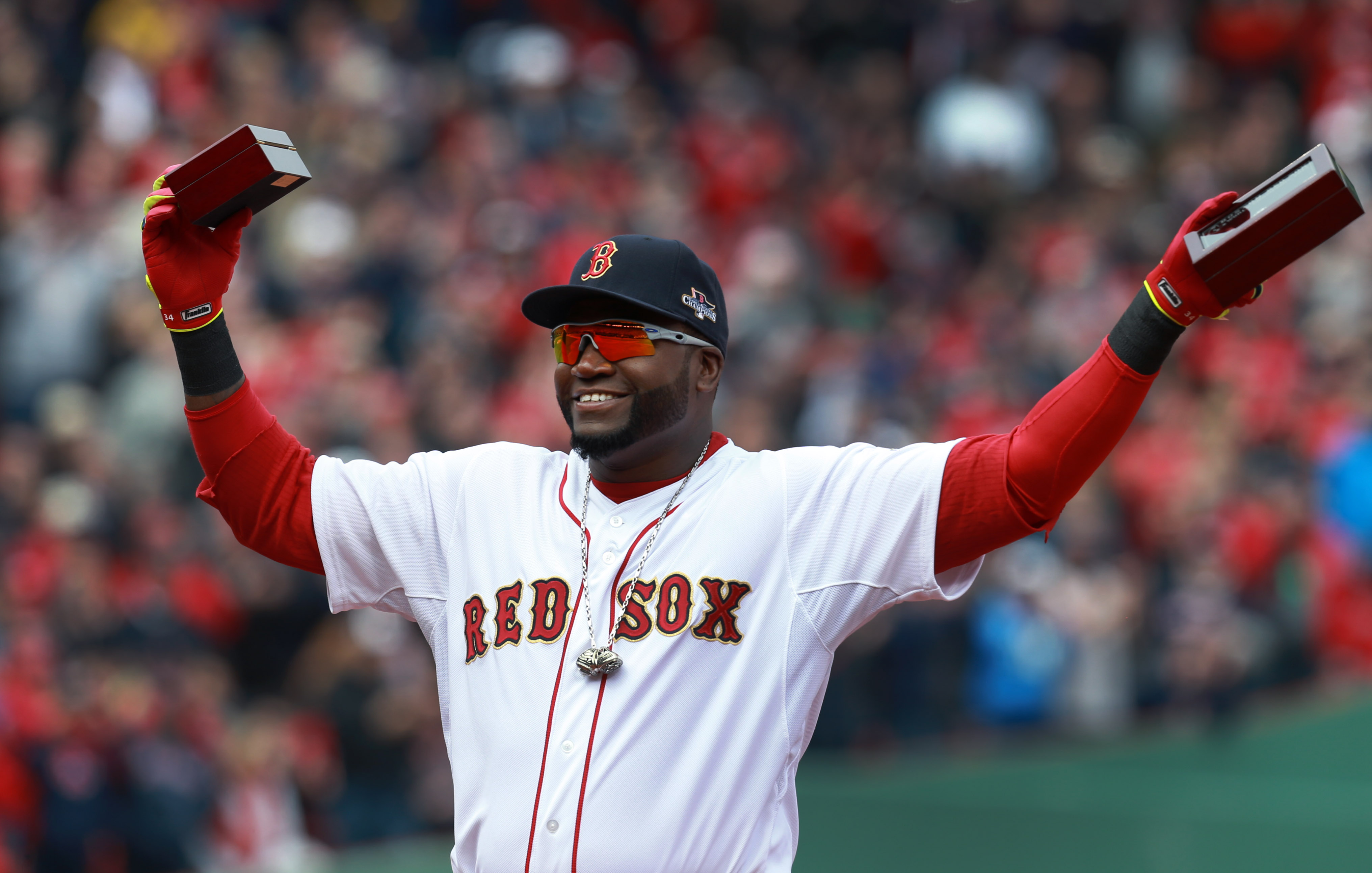 The ubiquitous David Ortiz added a 2013 championship ring and World Series MVP ring to the baubles from 2004 and 2007 around his neck.