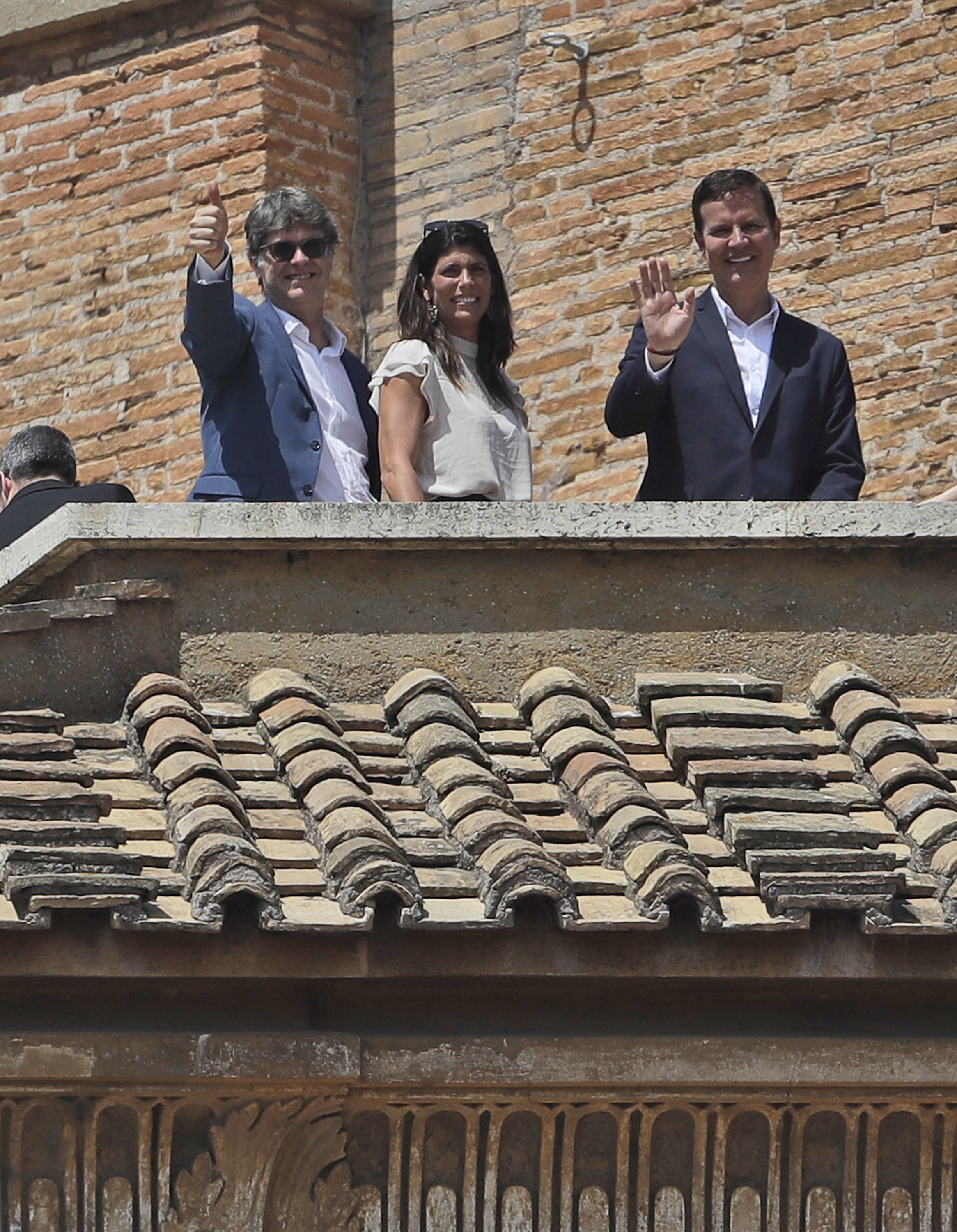 Sex abuse victims James Hamilton (left) and Juan Carlos Cruz waved as they stood on a terrace overlooking St. Peter's Square during a prayer celebrated by Pope Francis, at the Vatican, Sunday.