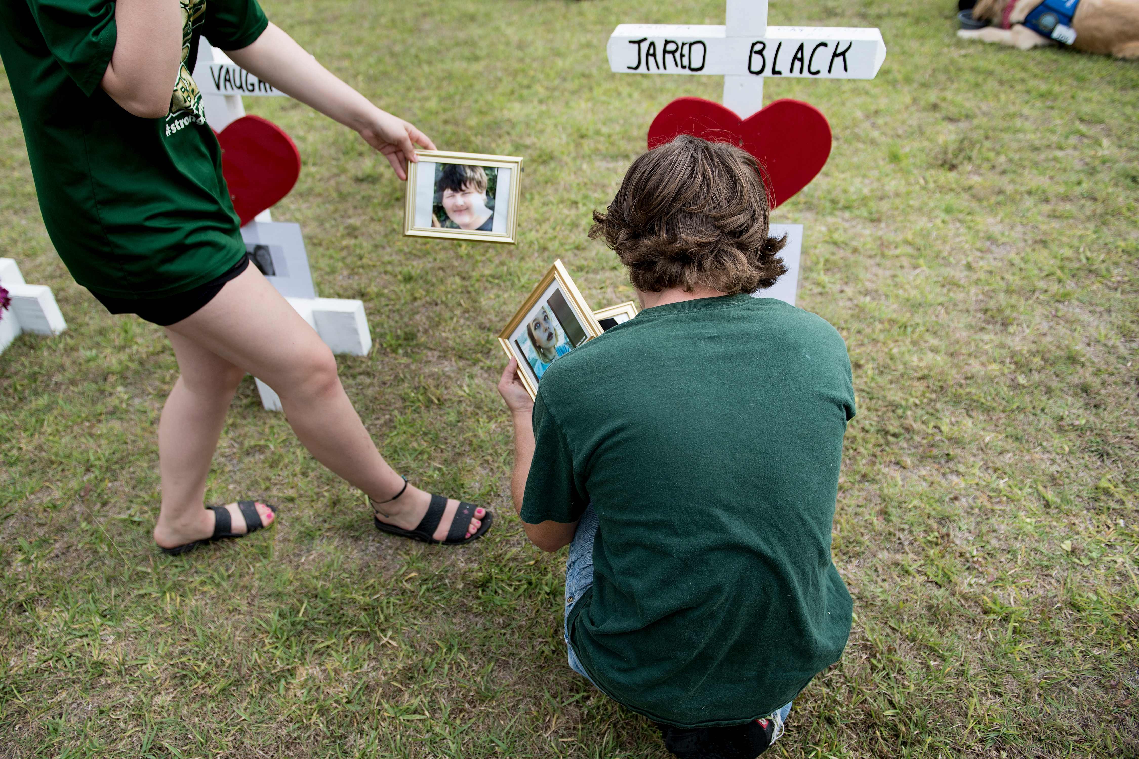 James Otto placed photos at a cross for Jared Black.