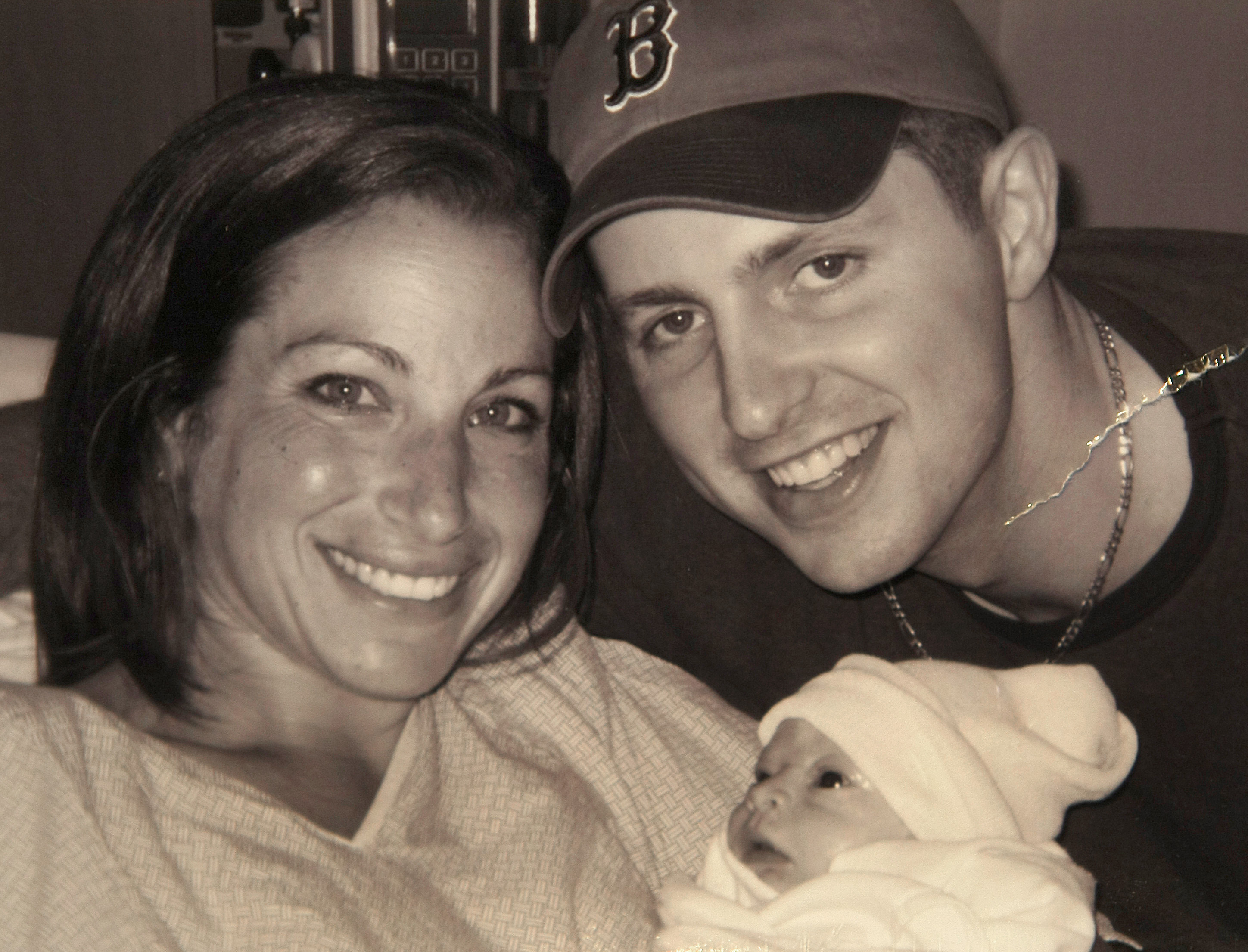 A family photo of Andrea Larkin and her husband, Tim, with Alexa.