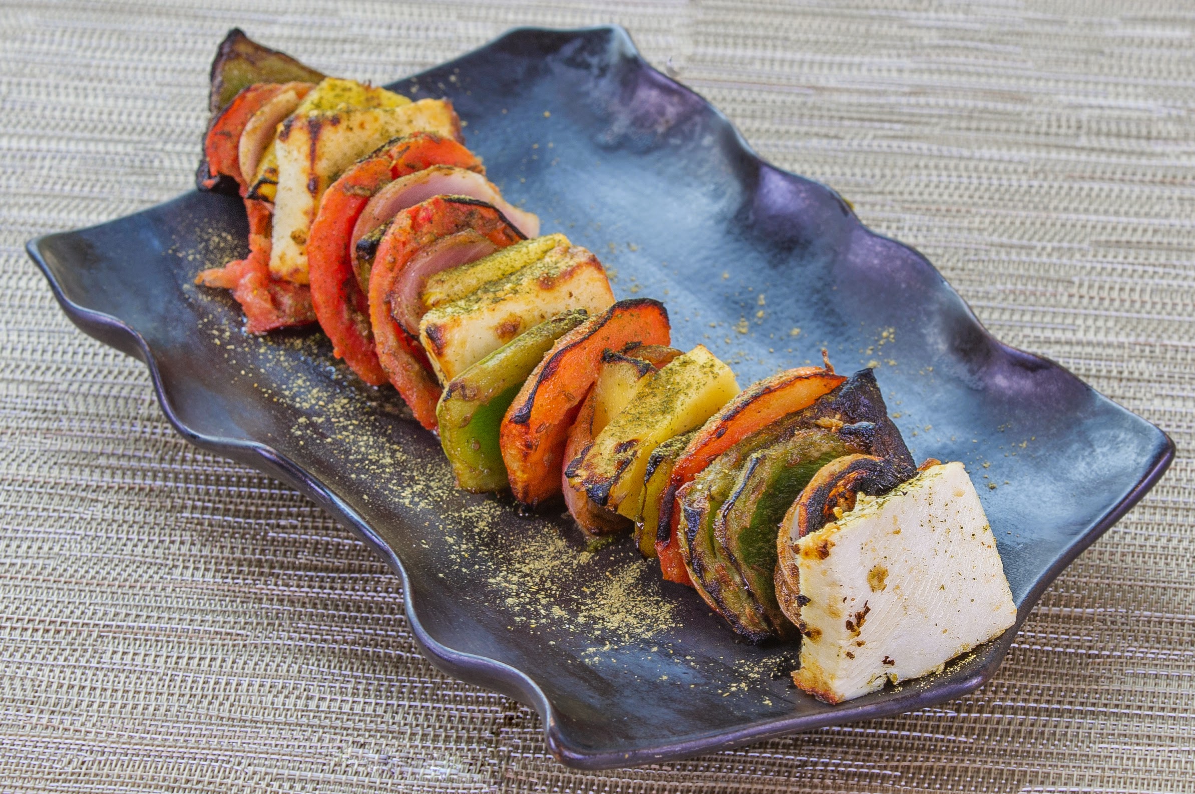 A grilled kebab of spiced vegeta-bles and cottage cheese.