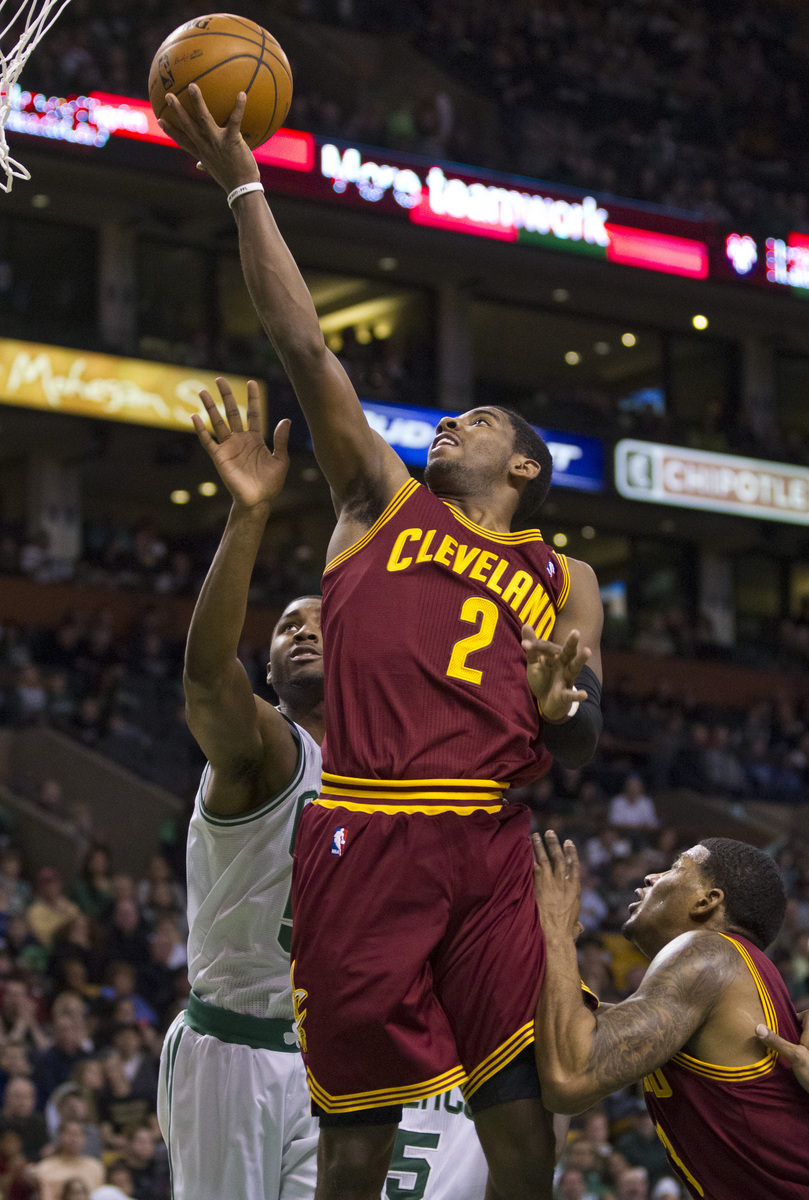 Kyrie Irving beats the Celtics’ E’Twaun Moore for an easy basket.