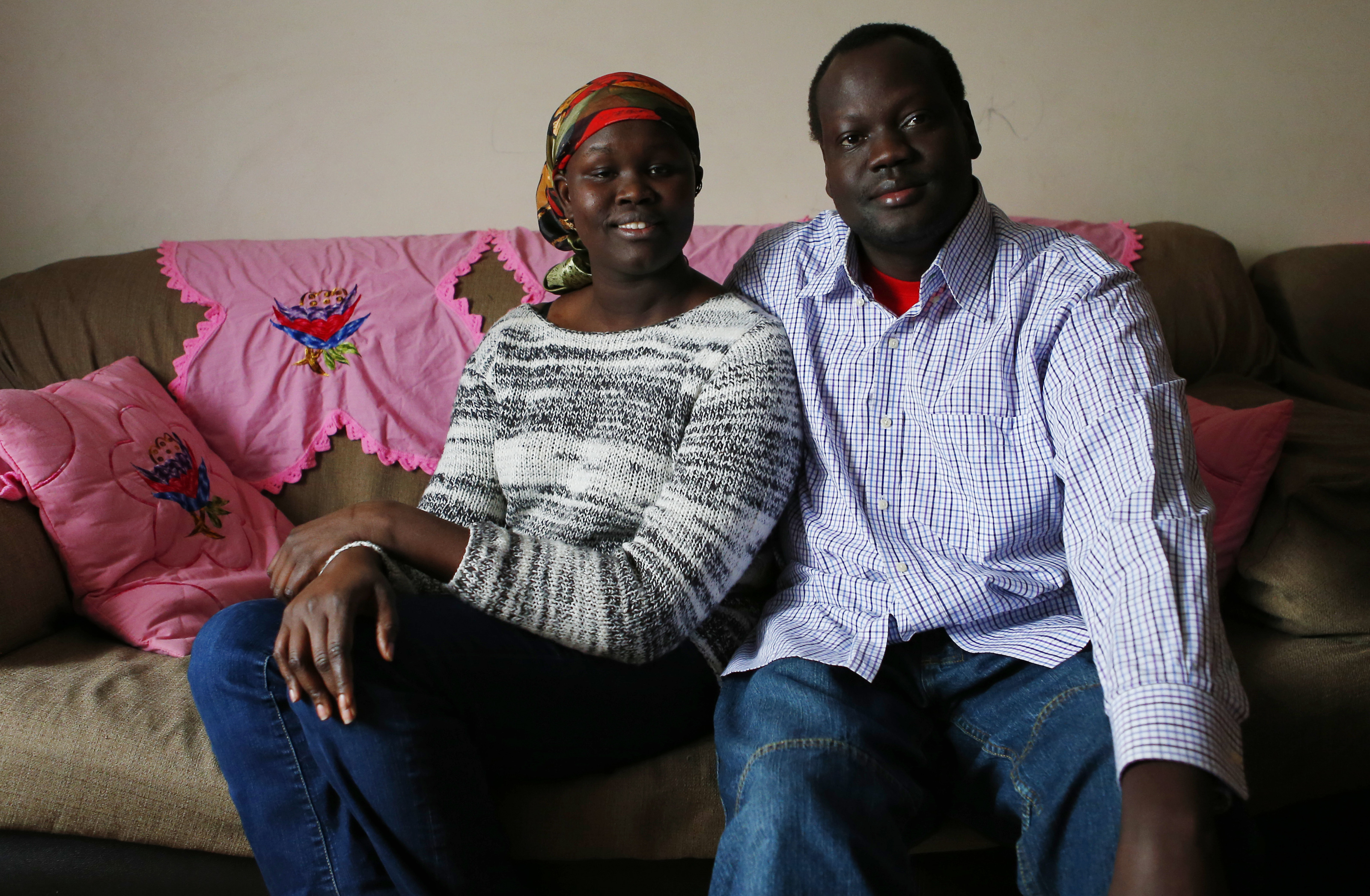 Yar Ayuel and her husband, Emmanuel Deng — working grad students, parents of three — at home in Arlington.