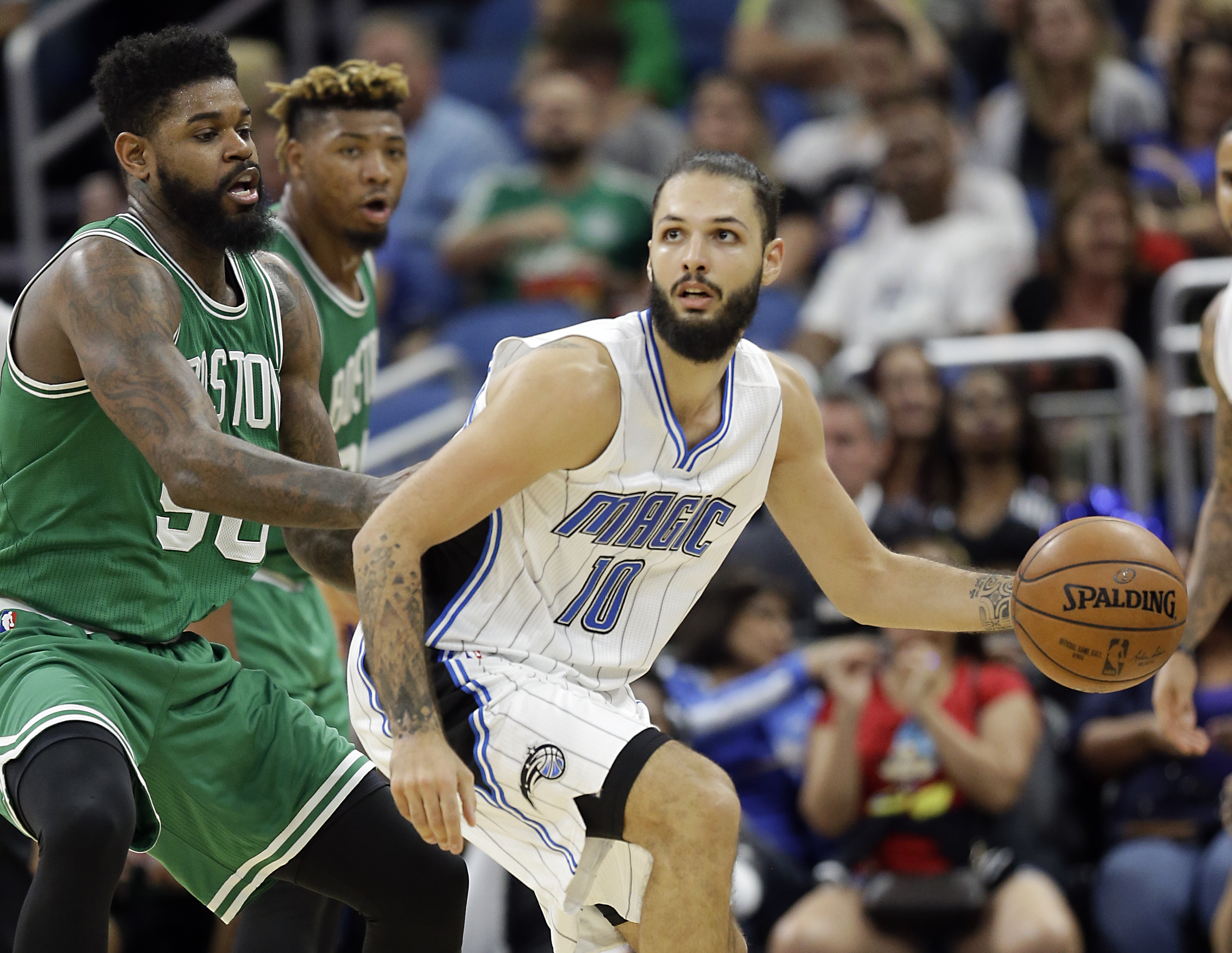 Evan Fournier (right) is defended by Amir Johnson in the second half.