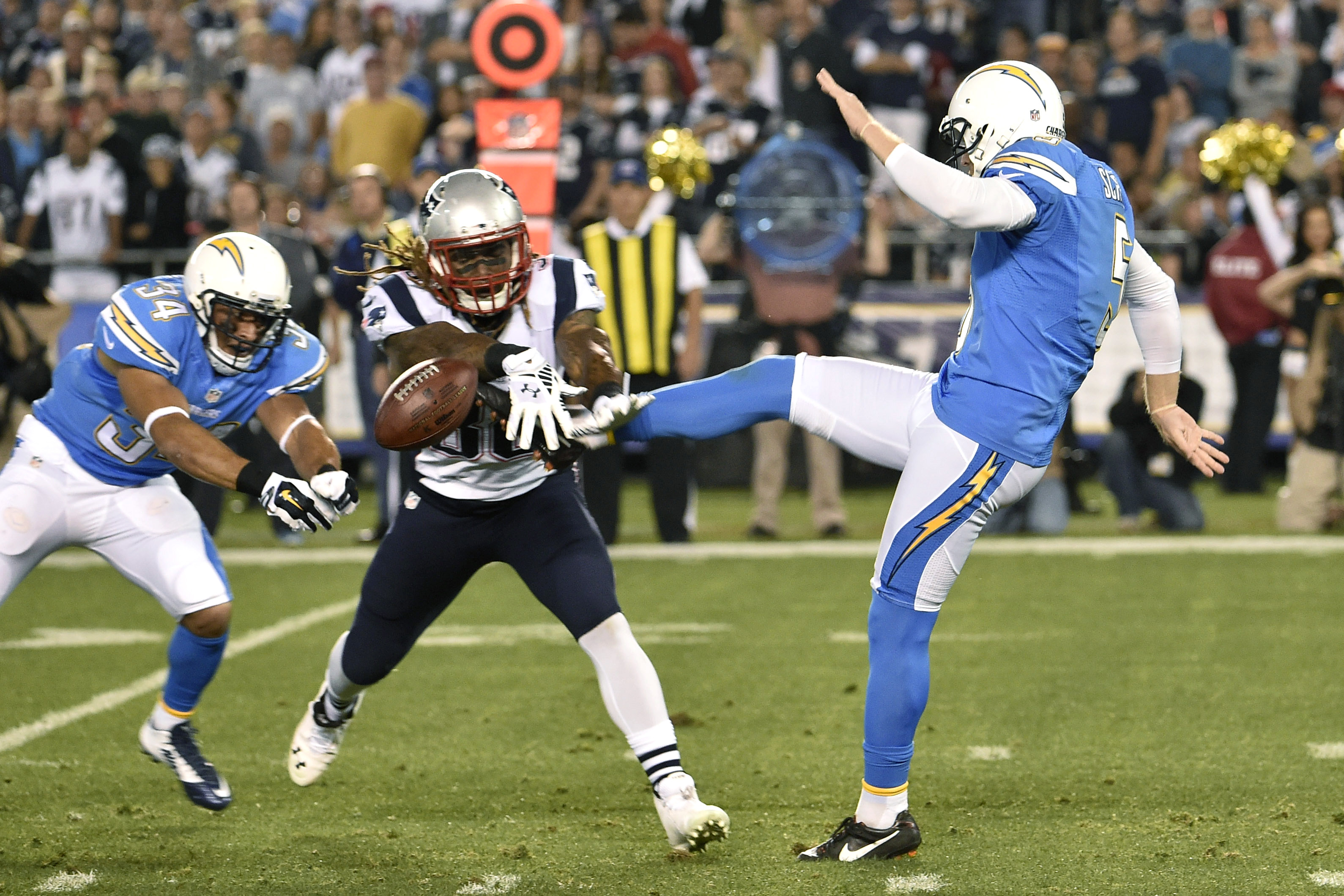 Chargers punter Mike Scifres was hit by the Patriots' Brandon Bolden on a punt attempt in the first half.