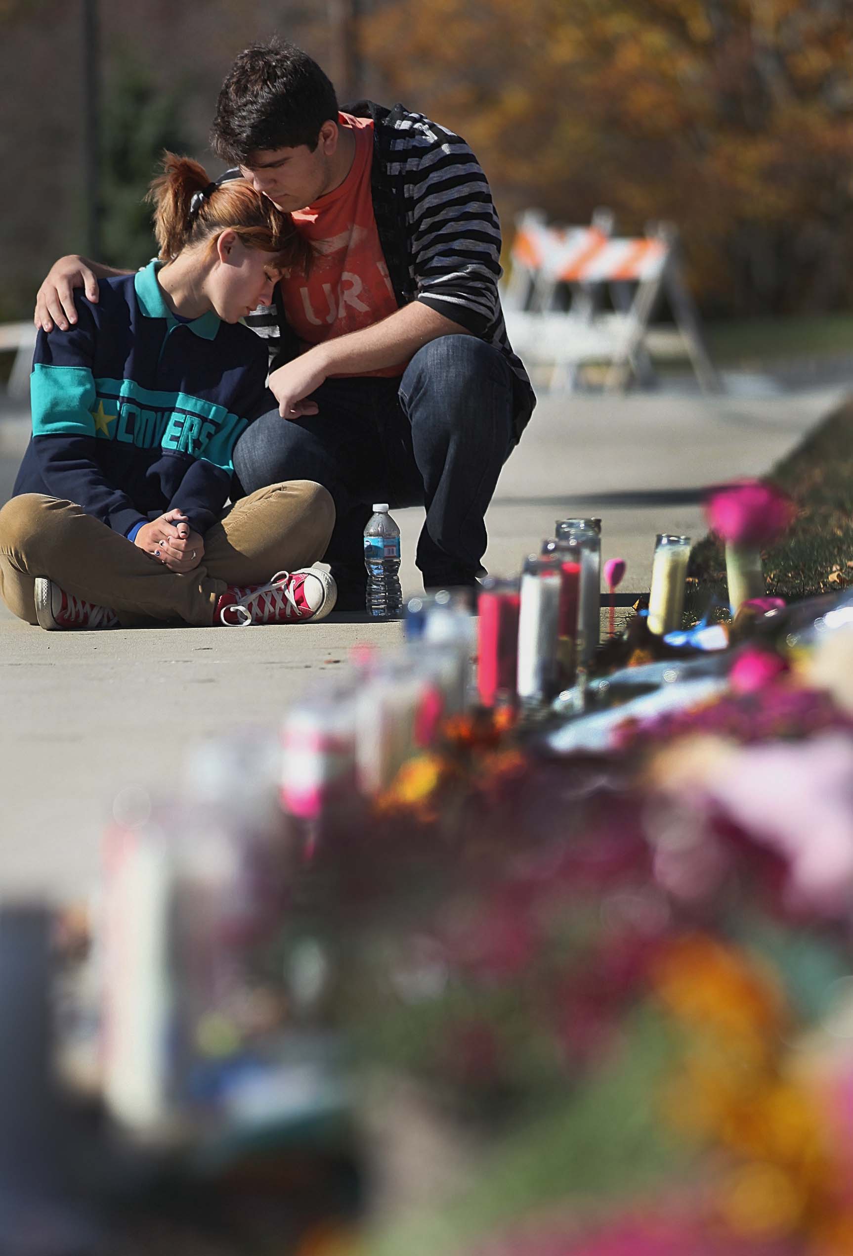 Cameron Trout and Kelsey Brooks paid respects at a memorial for slain teacher Colleen Ritzer after a grief counseling session at Danvers High School on Thursday.