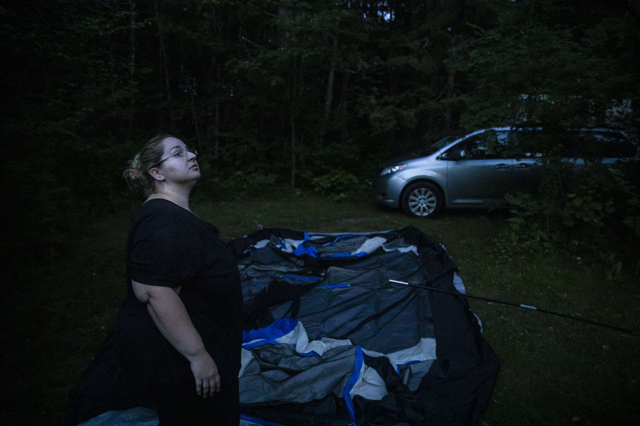 Mariah set up her family's tent in the waning moonlight next to beachgoers and vacationing families at Shamrock Campground in Biddeford, Maine. The Lupien family would be making the tent their home.