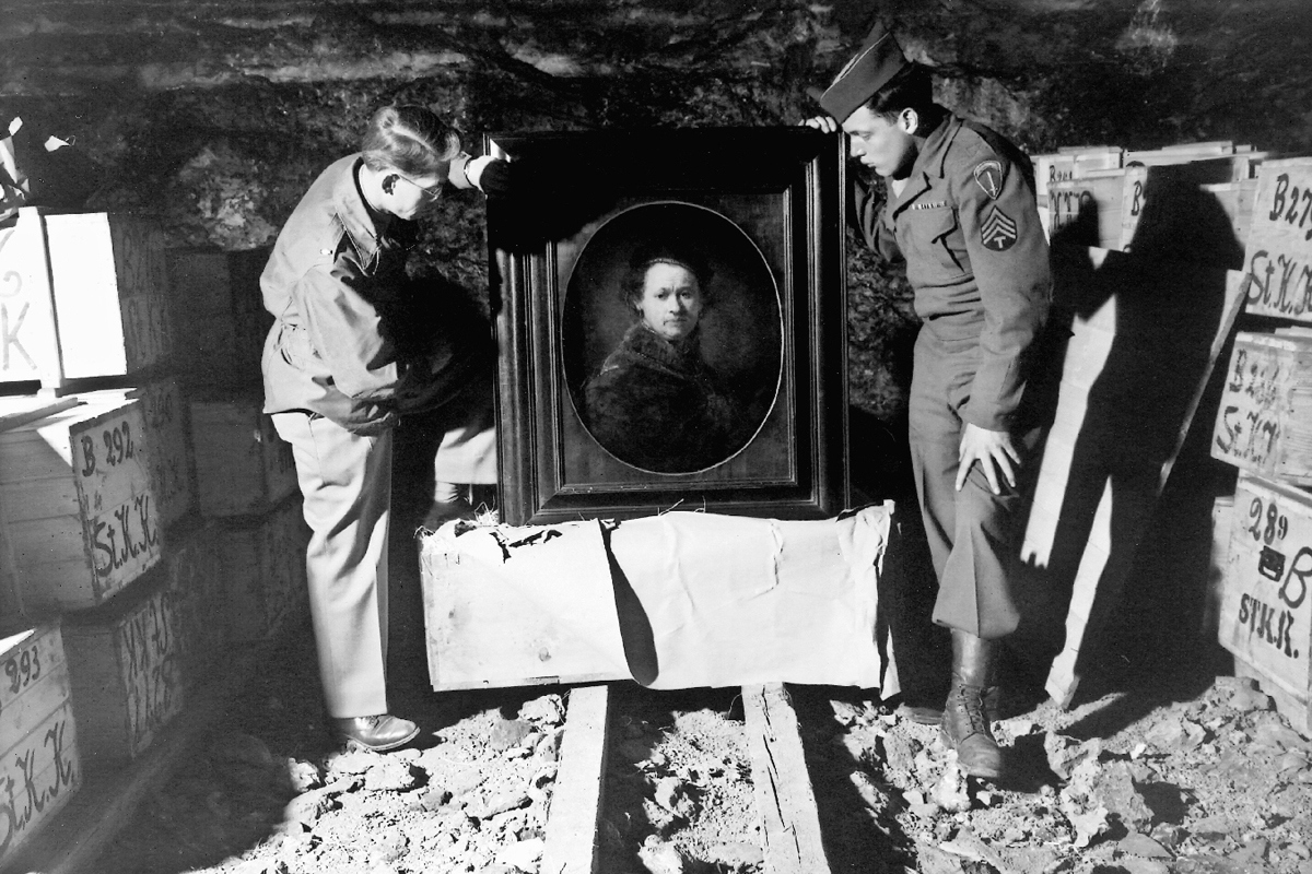 Two of the real Monuments Men inspected a Rembrandt self portrait that was stored in a German mine during WWII.