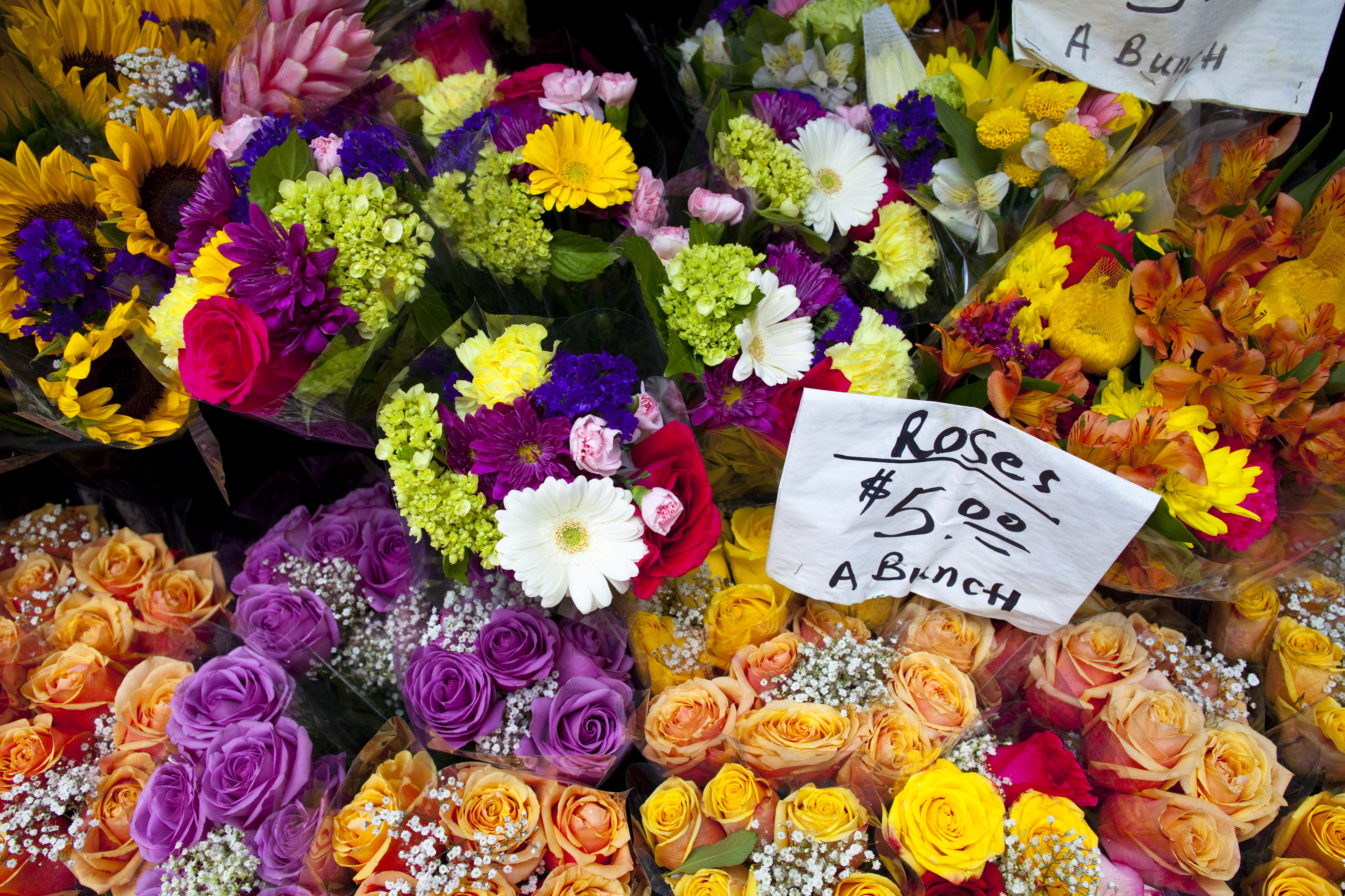 Flowers for sale from a pushcart vendor.