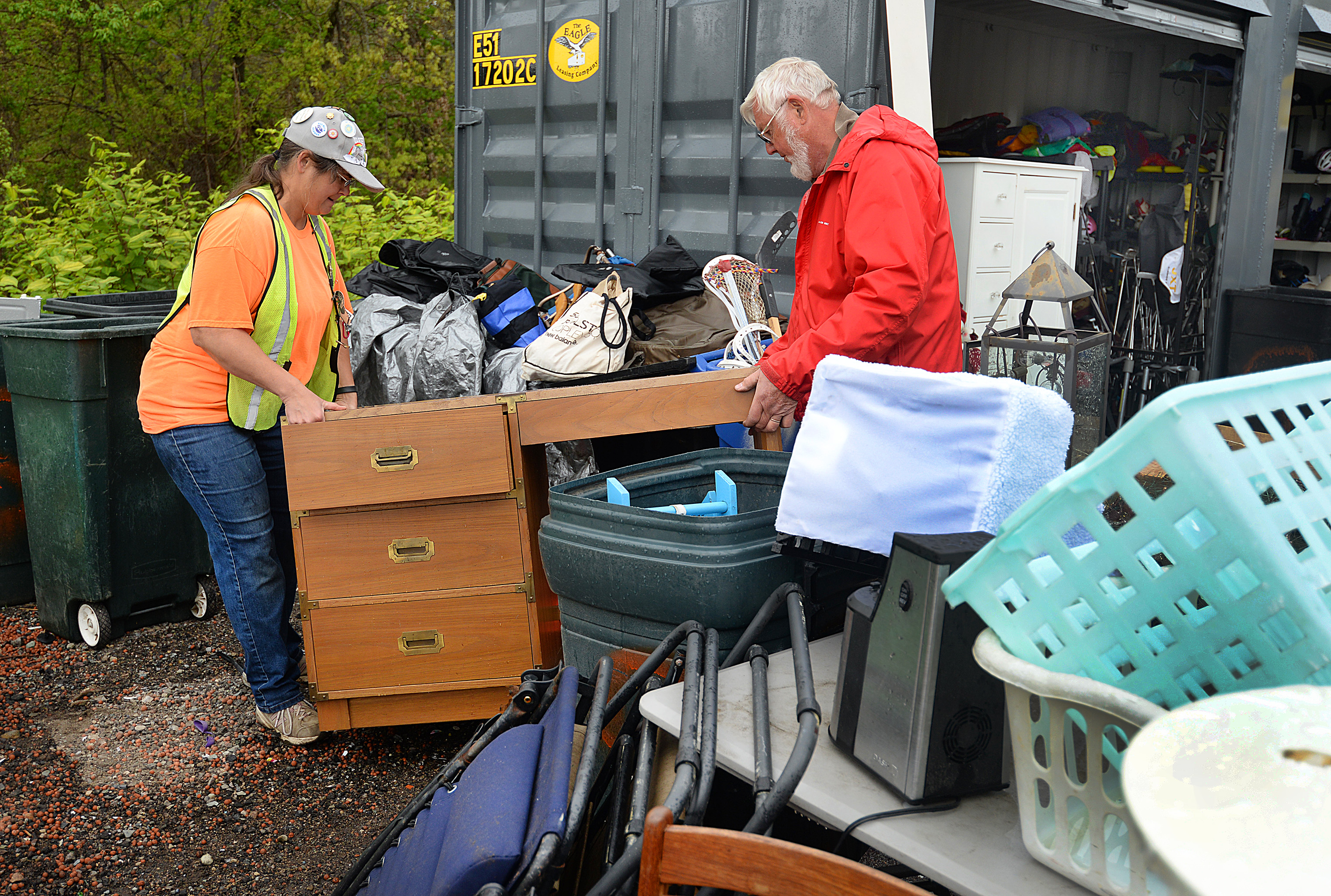 Paula Mine and Bill Marshall move a desk that was dropped off at the Hingham transfer station.