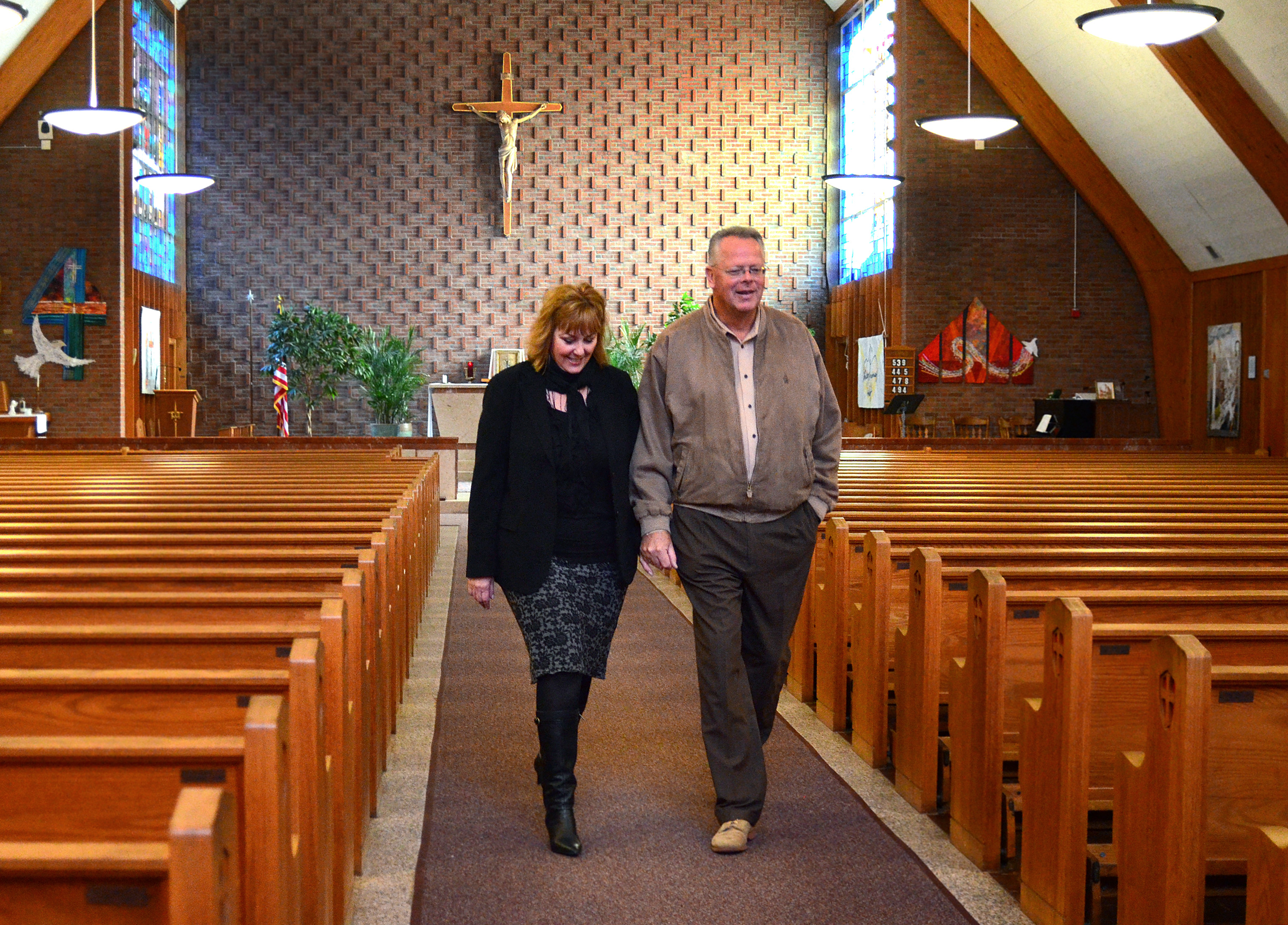 Maryellen and Jon Rogers walked through the church.