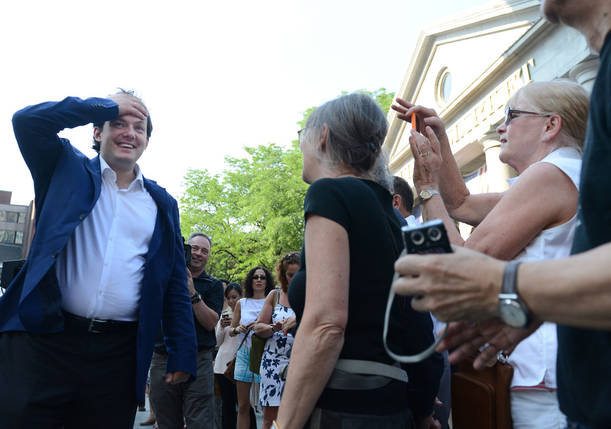 Andris Nelsons was greeted outside Faneuil Hall, where he led a BSO brass ensemble in a movement by Mussorgsky.
