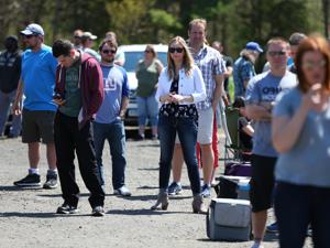 People wait in line outside of the Tree House Brewing Company for a beer release at noon.