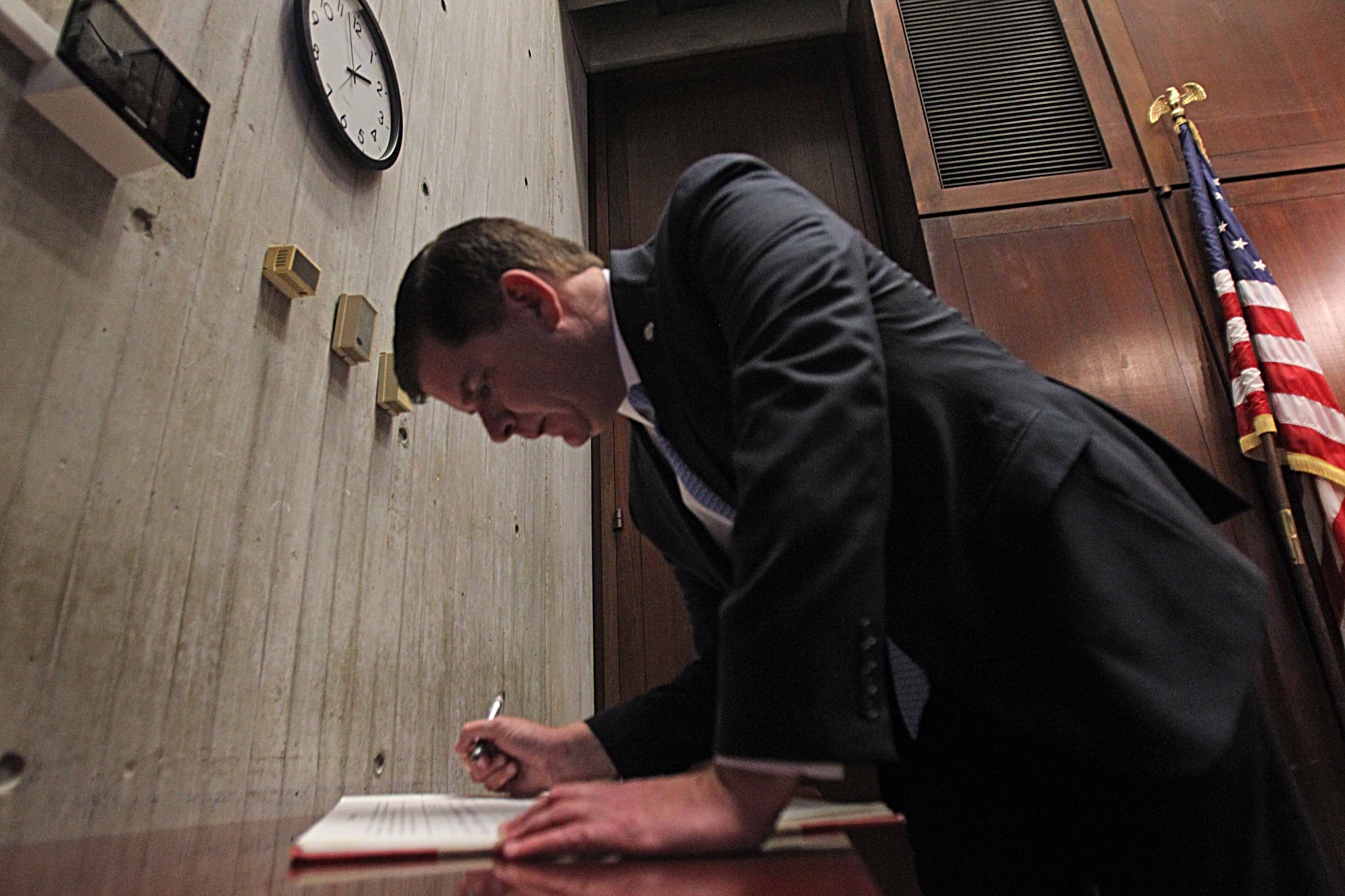 The mayor swore in new members of the school committee and then signed an official form on Jan. 5, 2014.