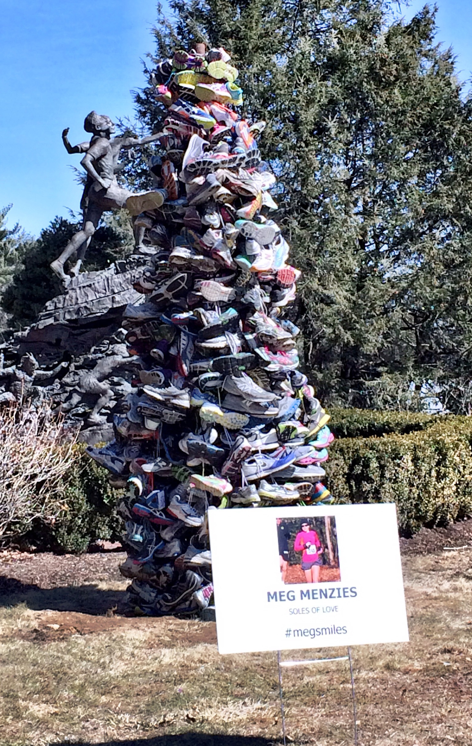 A memorial to Meg Menzies, a Virginia mother who was killed while training for this year’s race, was created by Hopkinton resident Kel Kelly from 400 pairs of running shoes.