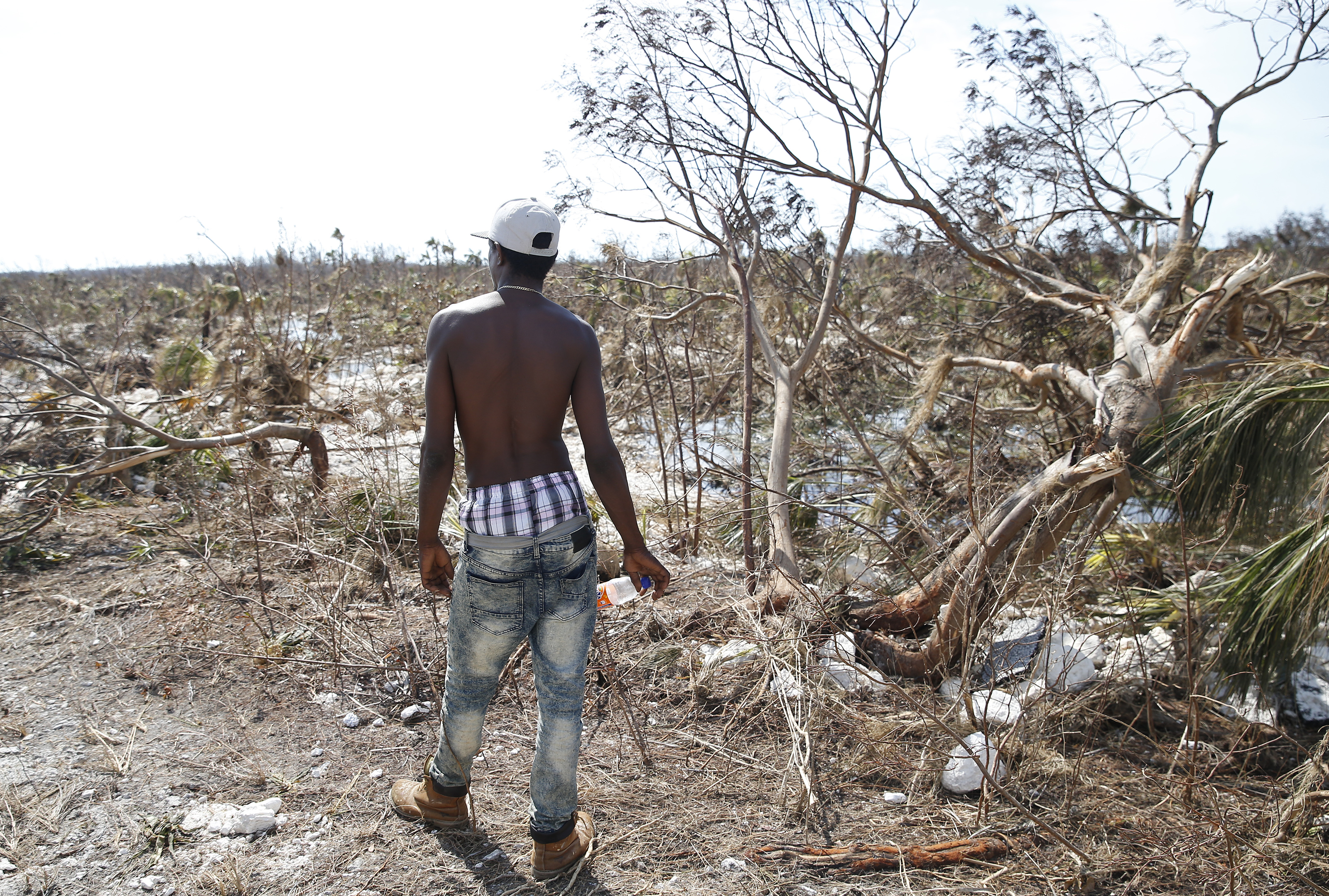A man in Freeport, Bahamas, paused to survey the damage left by Hurricane Dorian.