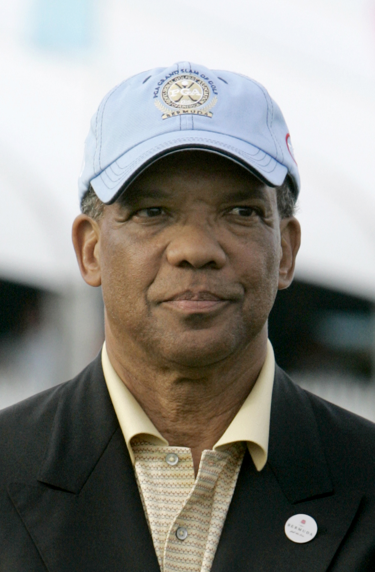 Ewart Brown, former premier of Bermuda, is accused in a lawsuit of accepting bribes to push business to Lahey Clinic. He is shown here at the trophy ceremony during the PGA Grand Slam of Golf tournament in 2007.