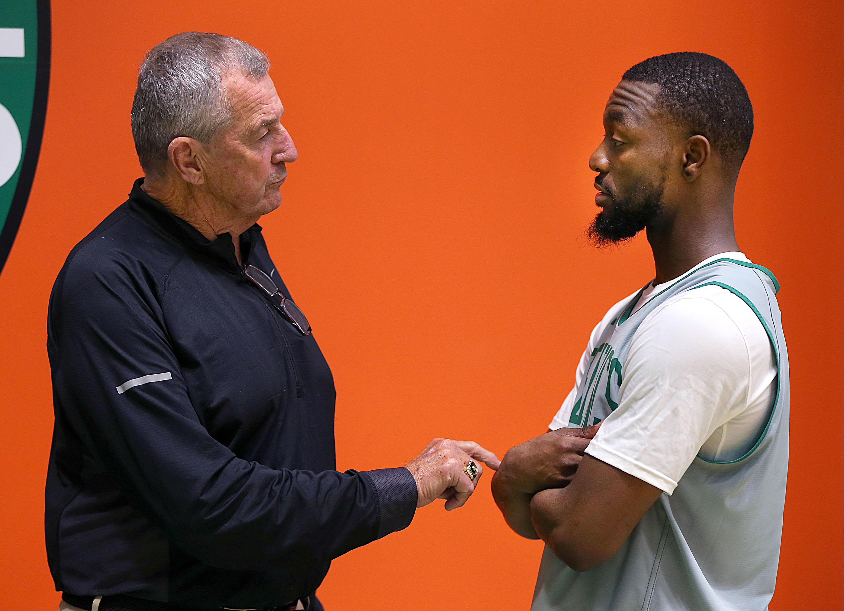 Kemba Walker talks with his college coach, Jim Calhoun, during training camp with the Celtics in 2019. Walker didn't need to be convinced – he wanted to join Calhoun's team in Storrs.