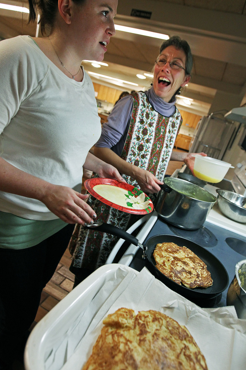 Anne McCants (right, with student Phoebe Biagiotti), chairman of the MIT History Department, teaches a class on food from the Middle Ages.