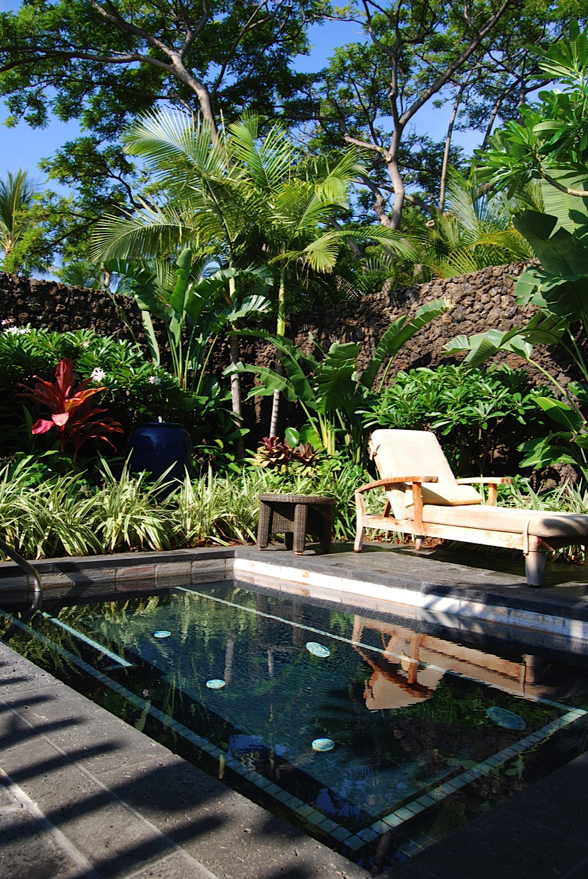 At Hualalai Spa, volcanic mud at the apothecary and the outdoor pool (pictured).