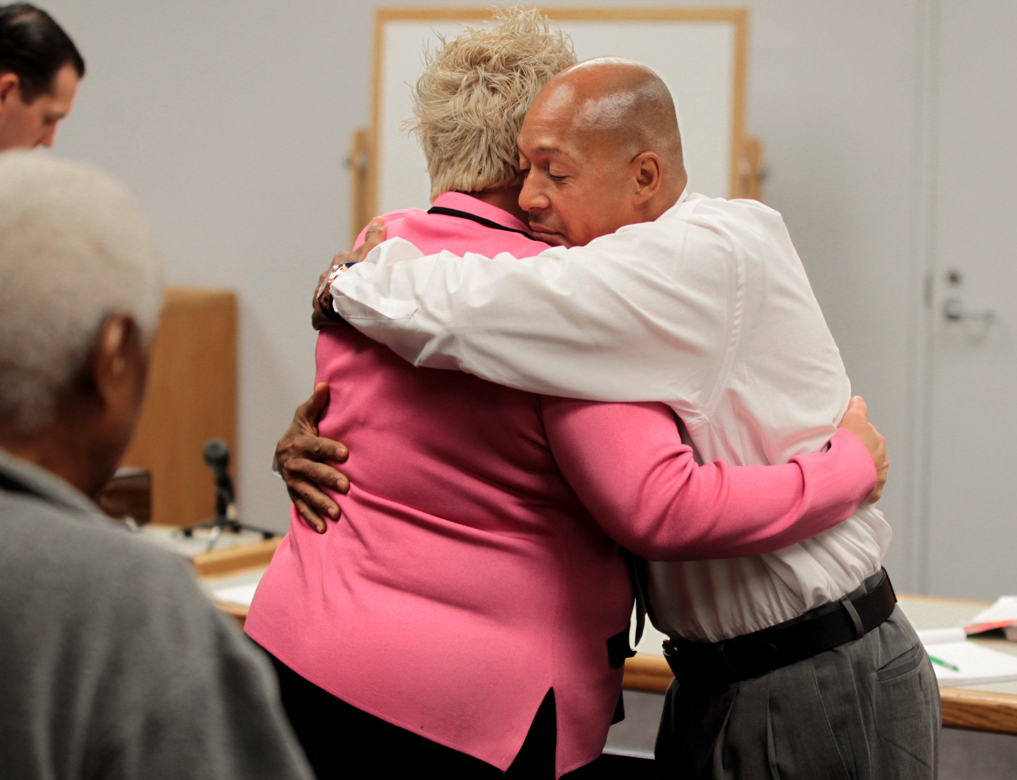 Scapicchio (left) embraced Shawn Drumgold after he was acquitted of drug charges in 2012.