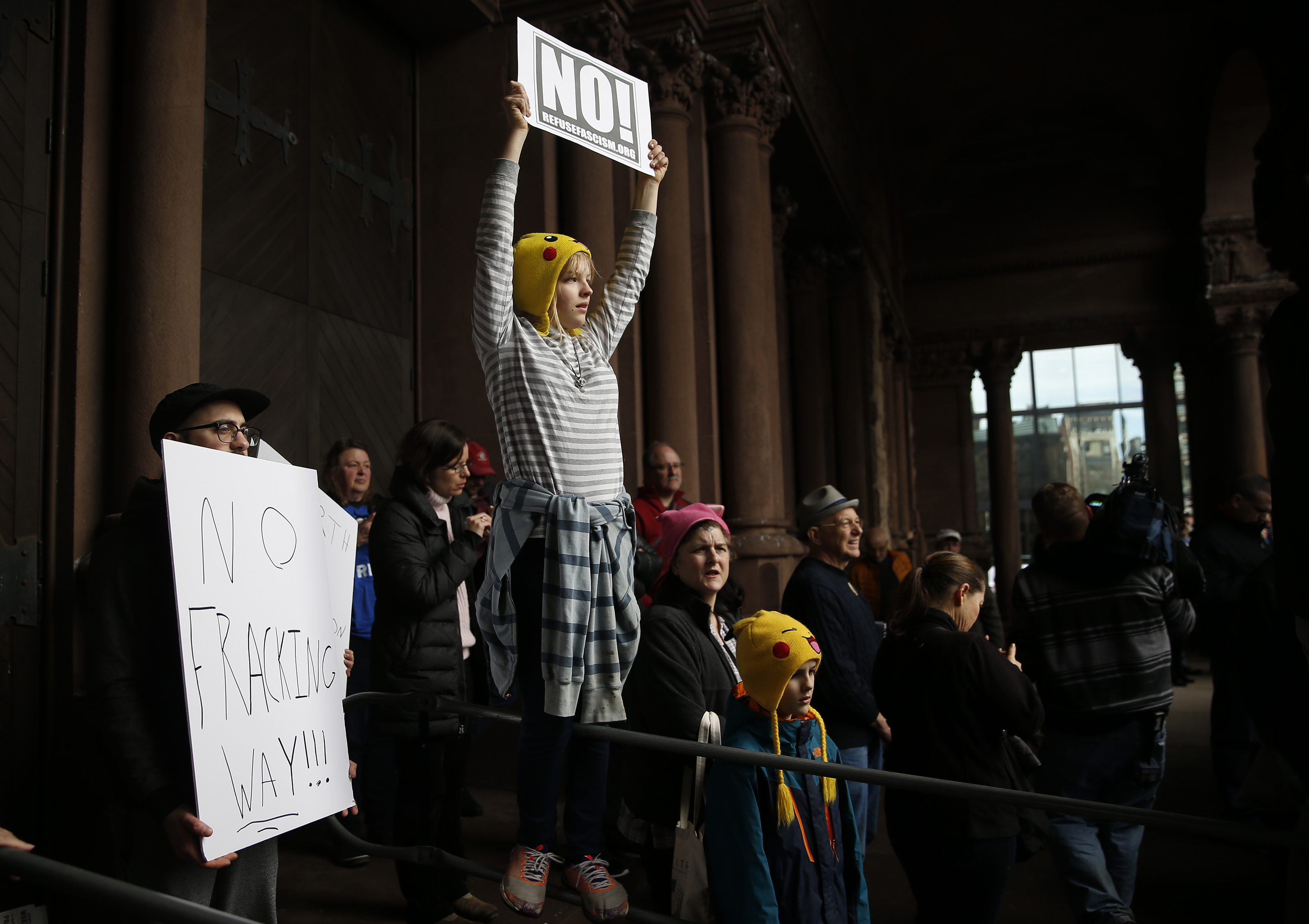 Grace Rodley, 13, of Scituate, held a sign as she, scientists, science advocates and community members rallied in Copley Square.