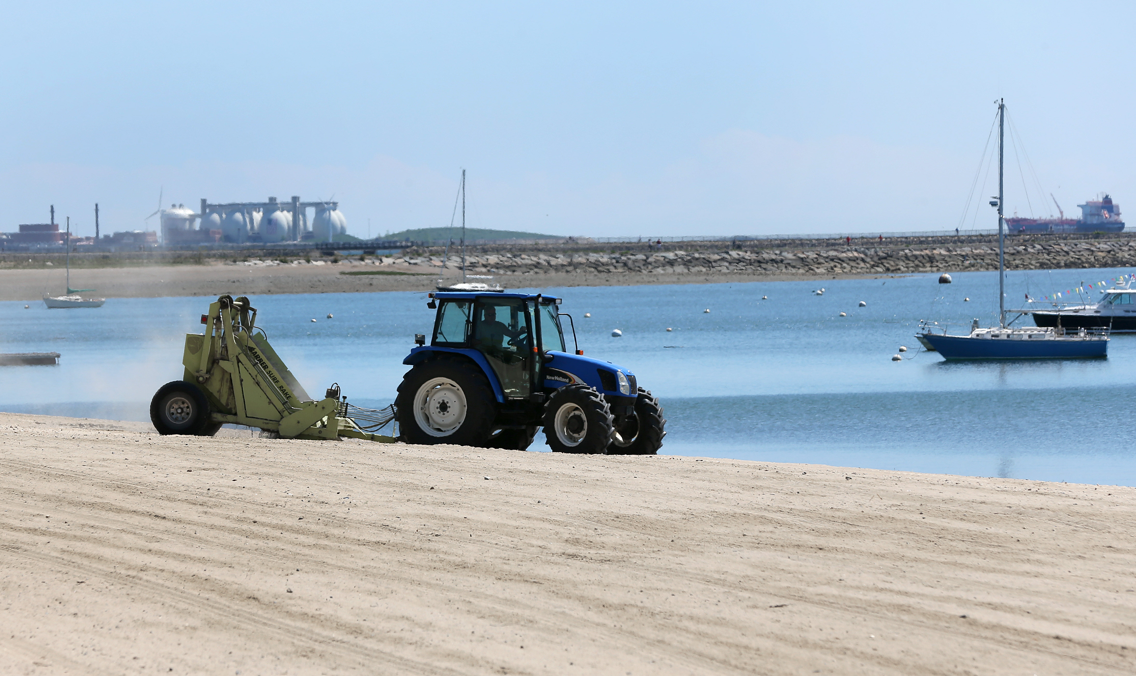 The Deer Island sewage water treatment plant, in the background, is a major reason that Boston Harbor has become clean over the past years.