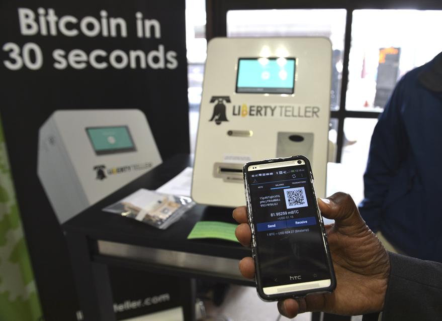 The Liberty Teller ATM at South Station began dispensing bitcoins to those who have a compatible app Wednesday.