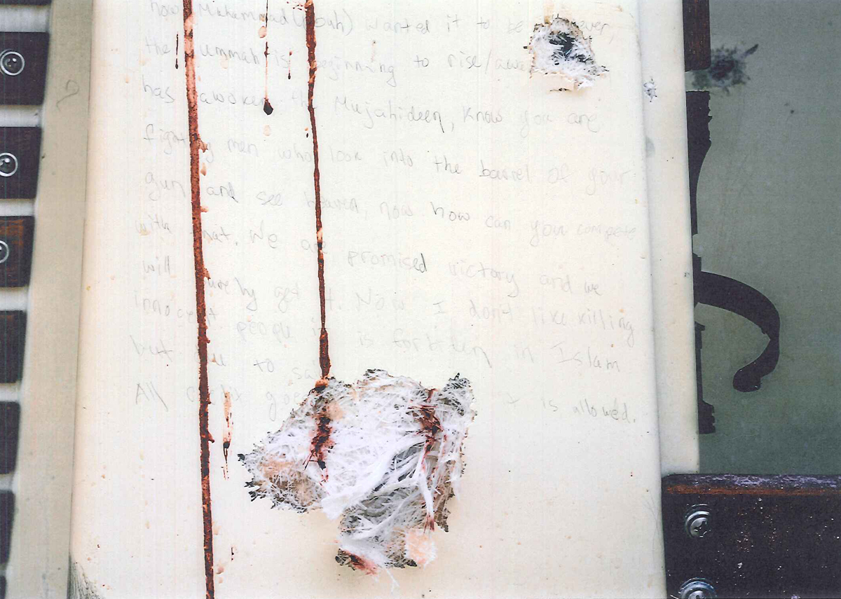 The bullet holes are from shots fired into the boat by police, according to a witness who testified Tuesday about the discovery of the writings.