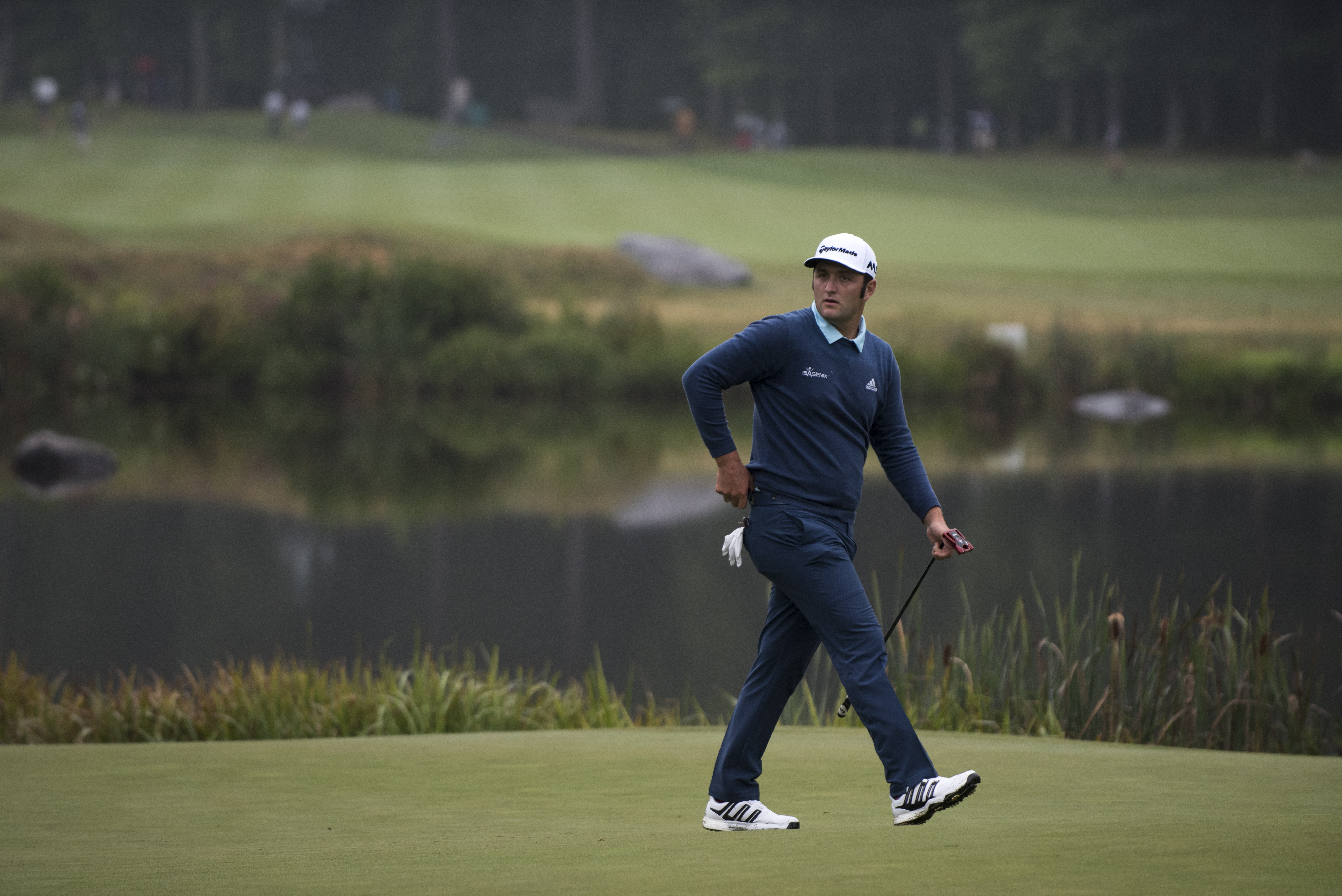 Jon Rahm walked off the sixth green with a par en route to his 71.