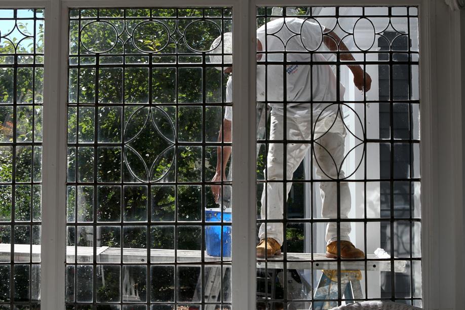 Painter works on home in Worcester’s West Side.