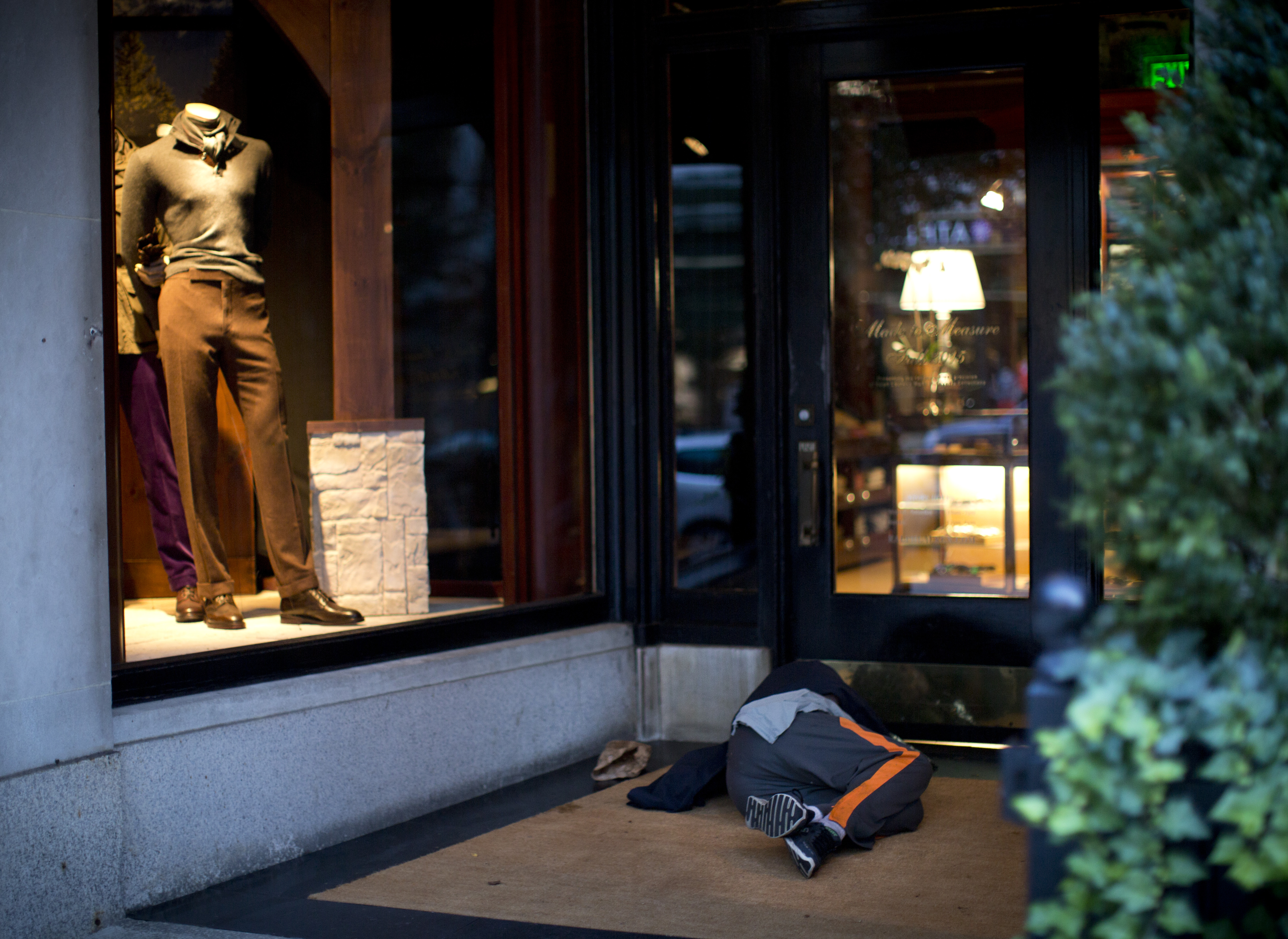 A man slept in front of a business last week in the Back Bay, where homelessness has recently come into stark relief.