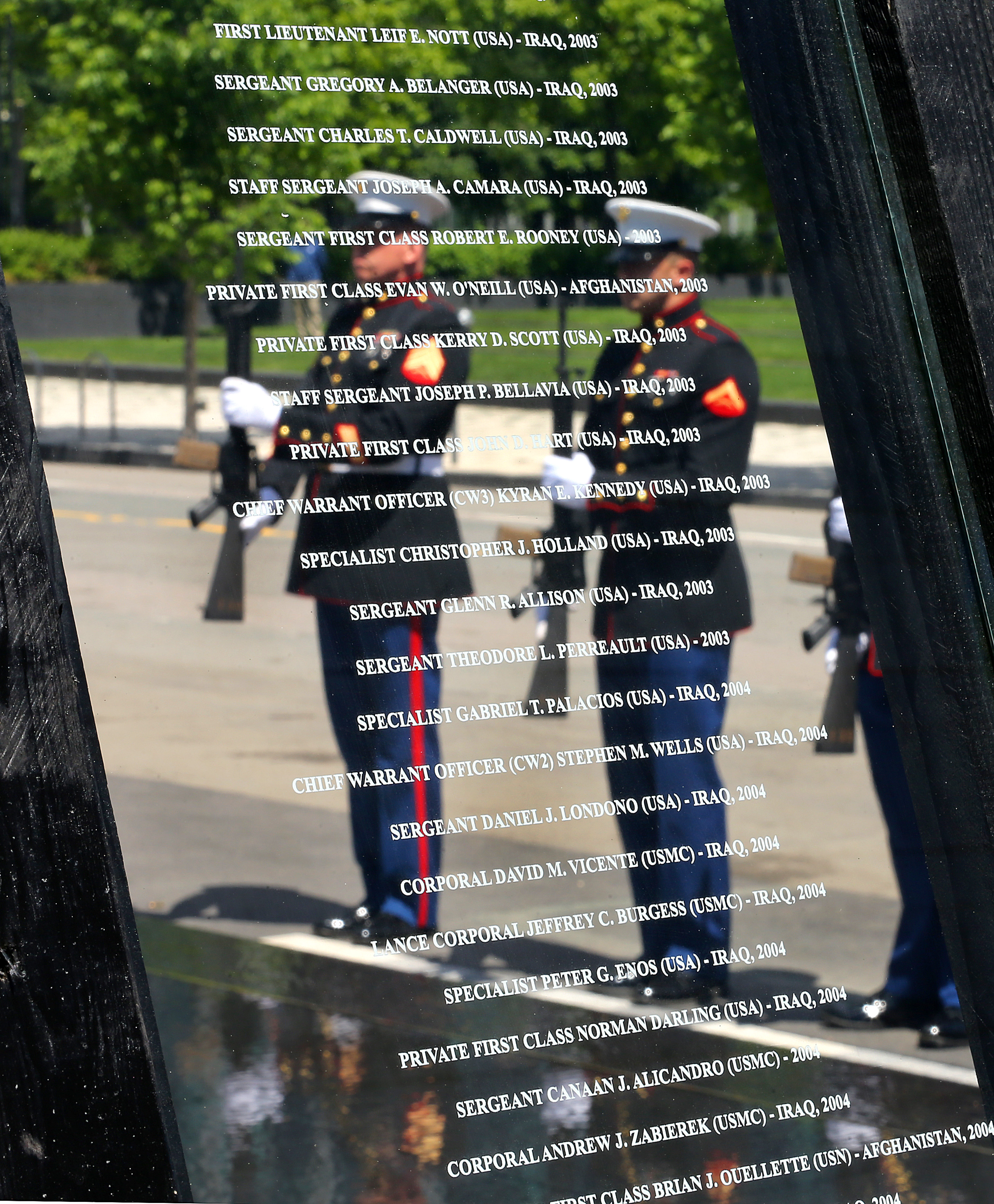 The names of those who died are etched in glass on panels at the Massachusetts Fallen Heroes Memorial.