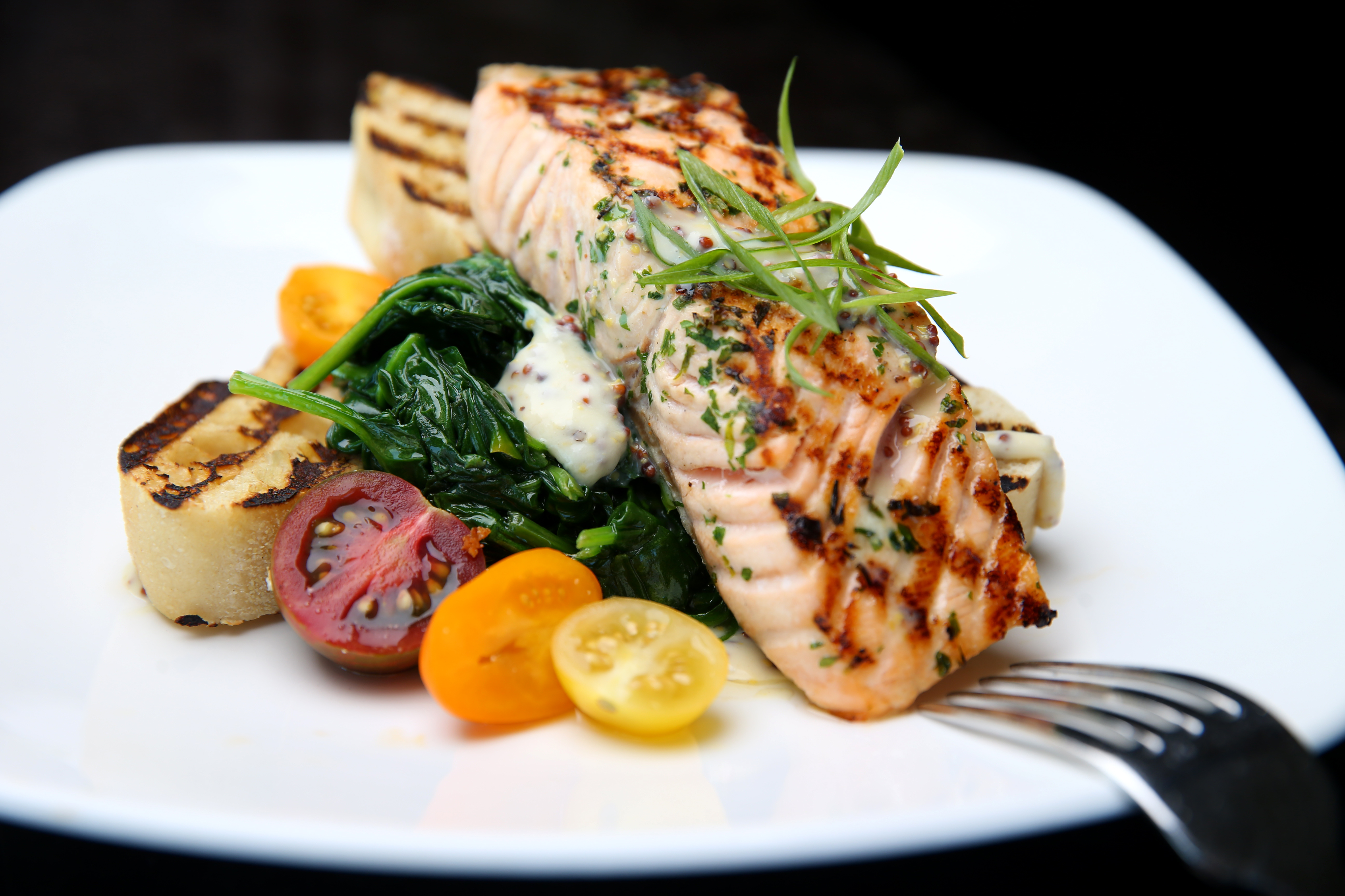 Open-faced grilled salmon sandwich.