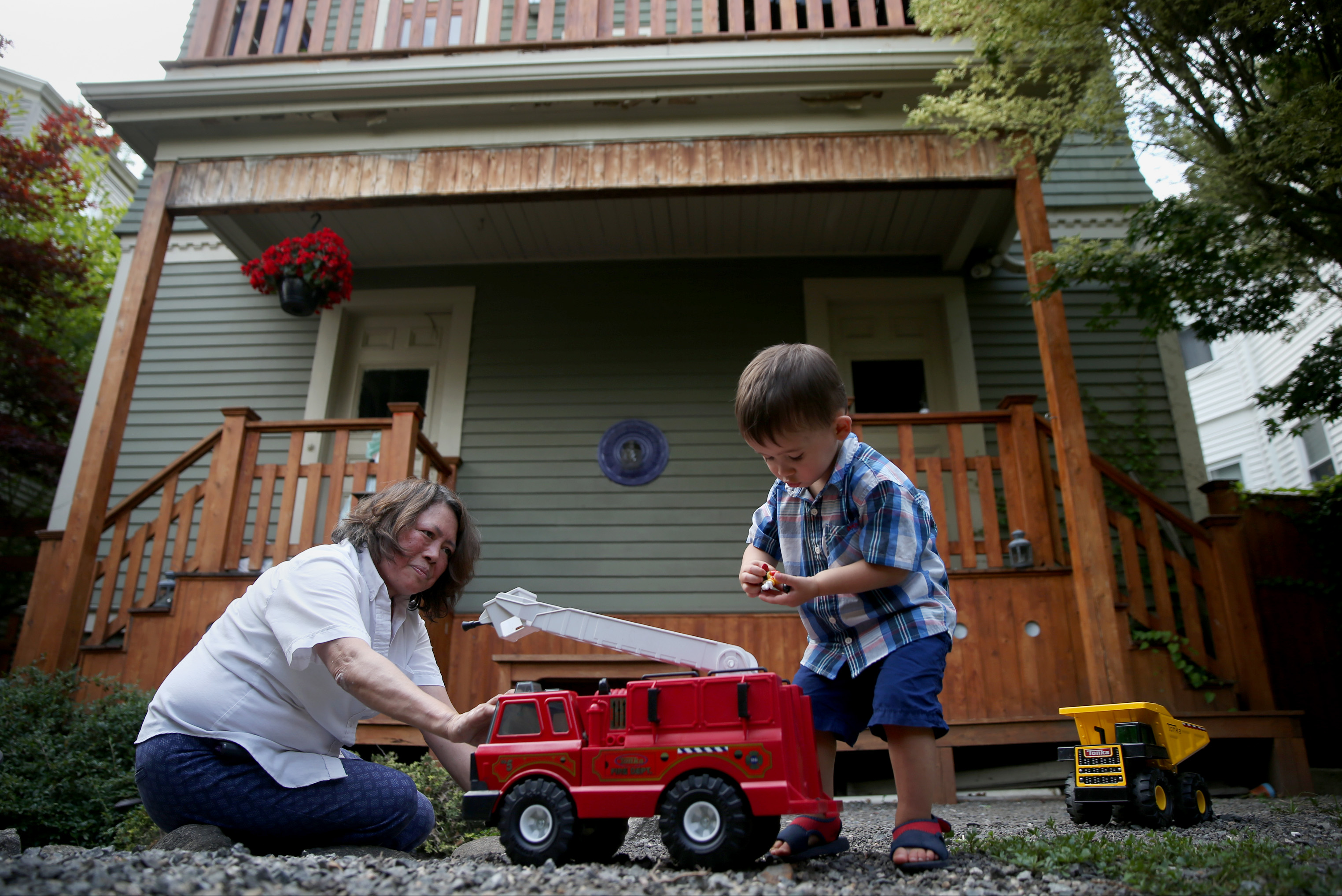 James Heckman plays with his grandmother, Gertrudes Euler, who sometimes baby-sits him after day care.