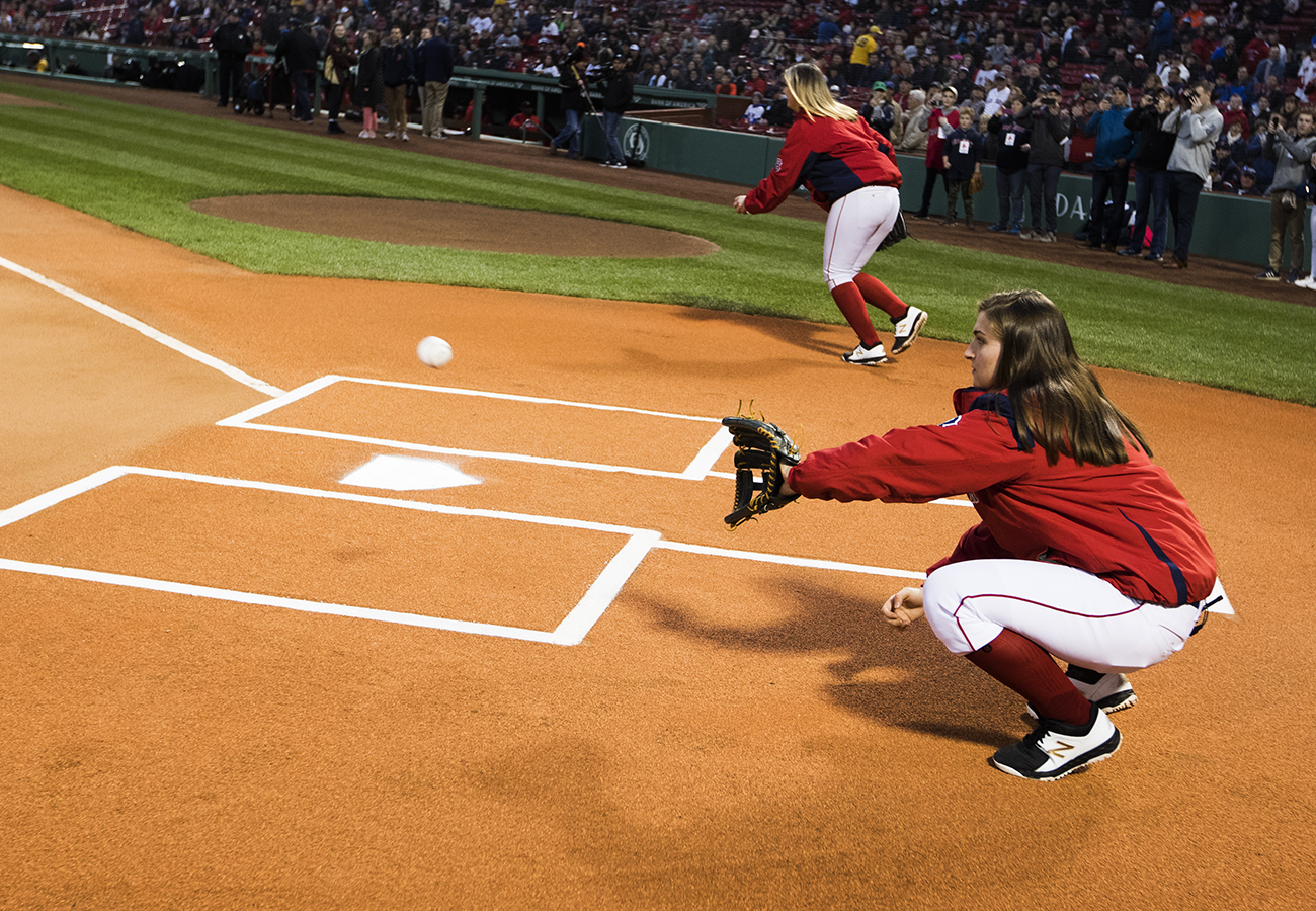 Catching a ceremonial first pitch before an April game vs. Baltimore.