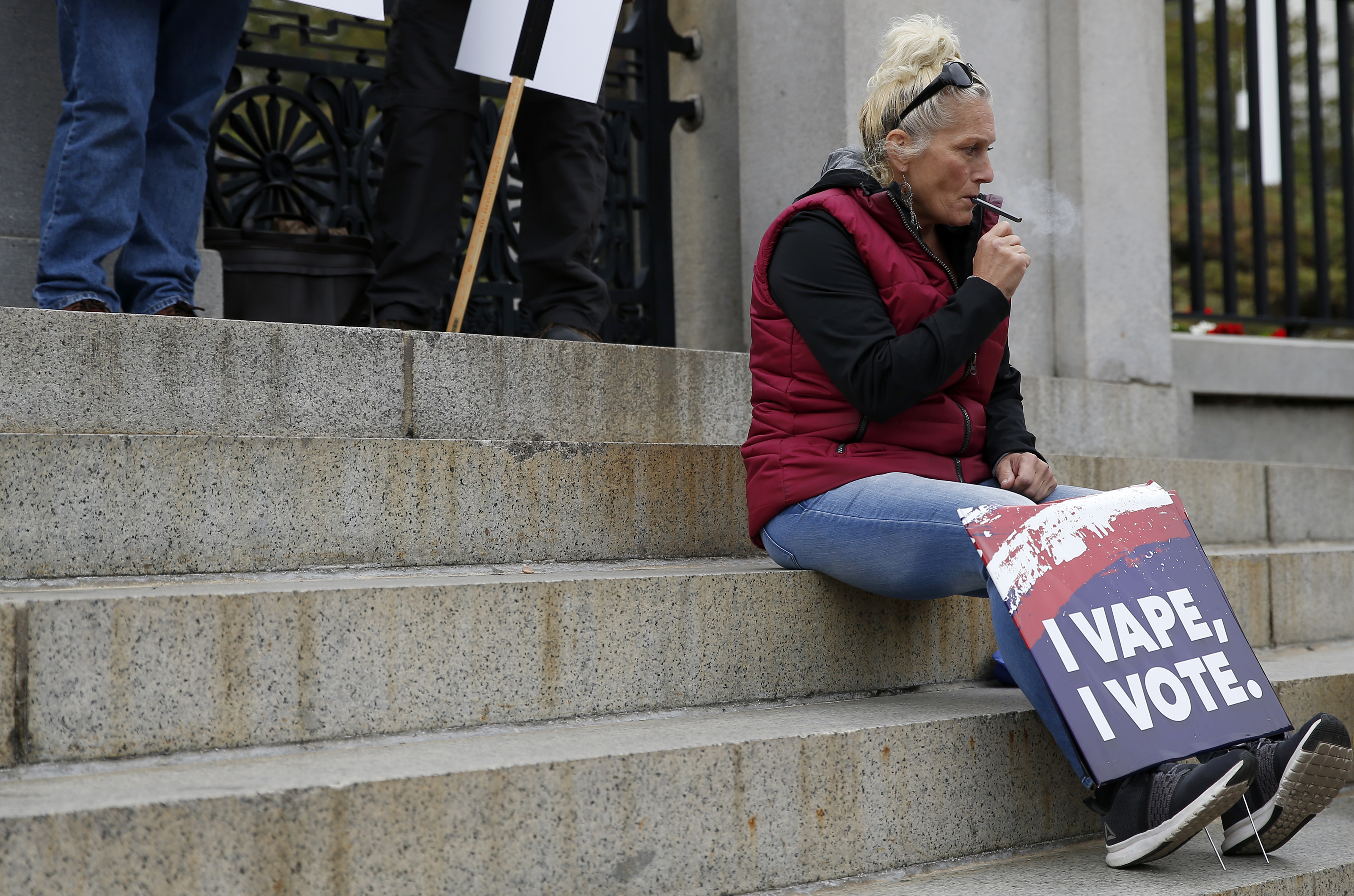 A woman vaped as she protested.