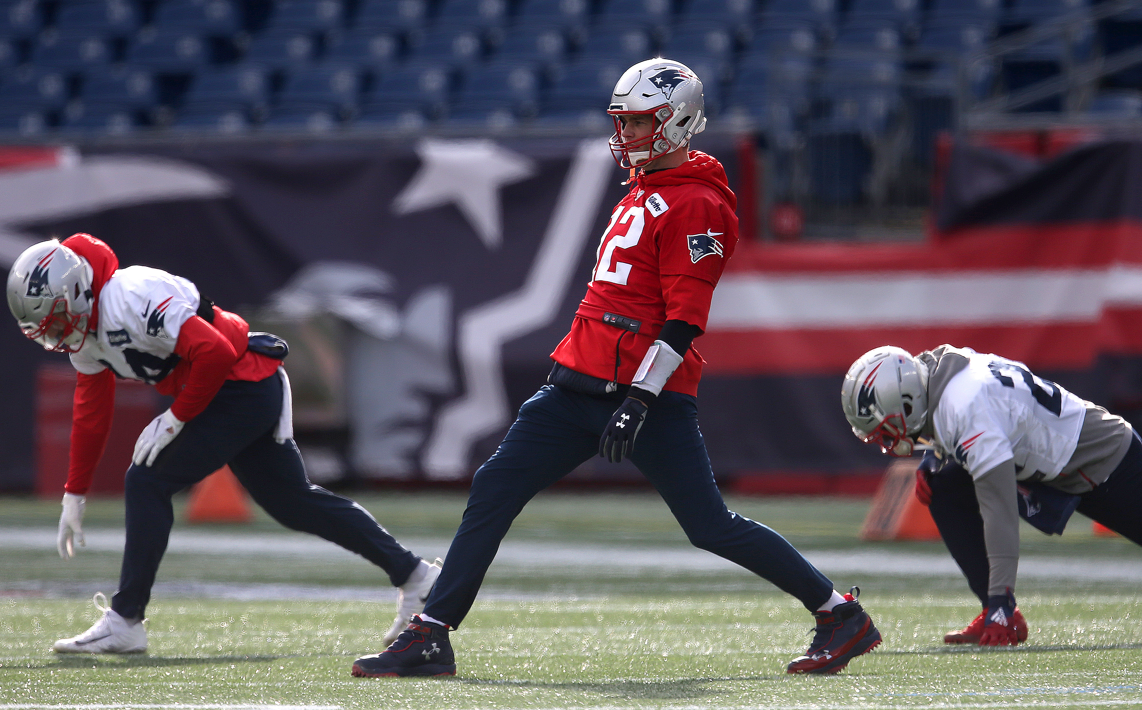 Tom Brady stretches before the start of practice on Thursday.