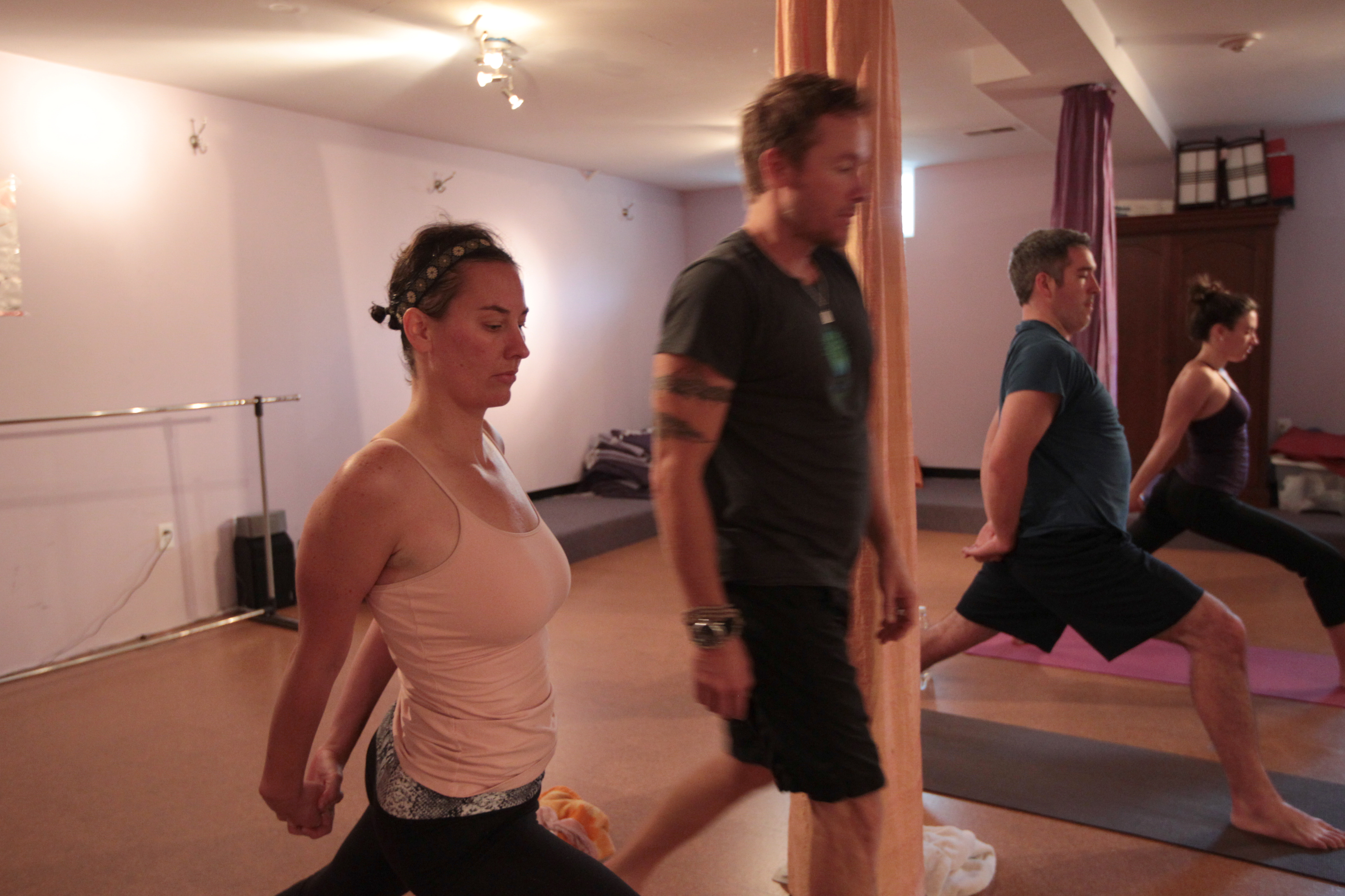 From left, Bethany Vasecka, Broga cofounders Robert Sedoti and Adam O'Neill, and Anya Woods took part in a Broga class at the Armory in Somerville.