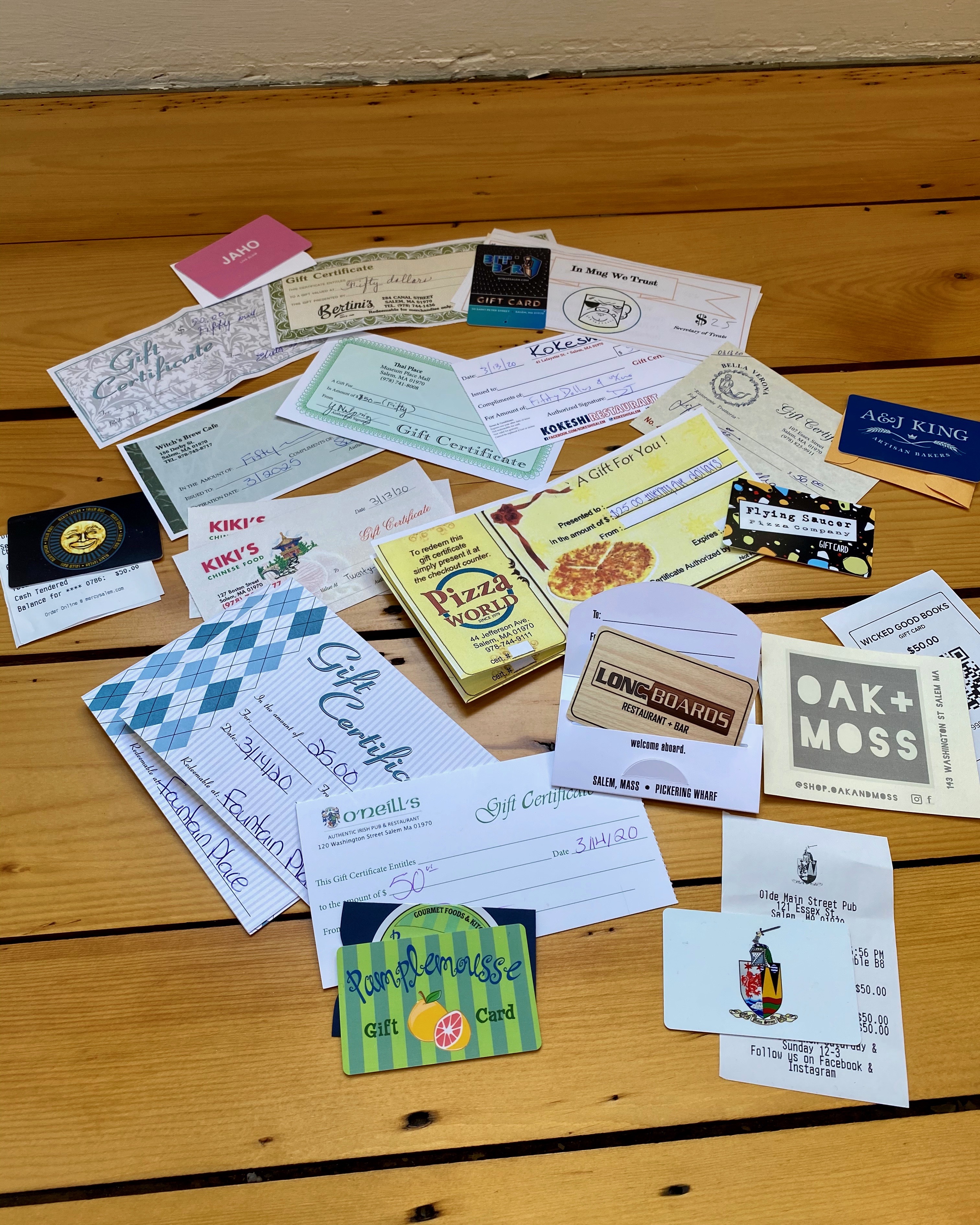 A handful of the gift cards to Salem businesses Obey purchased