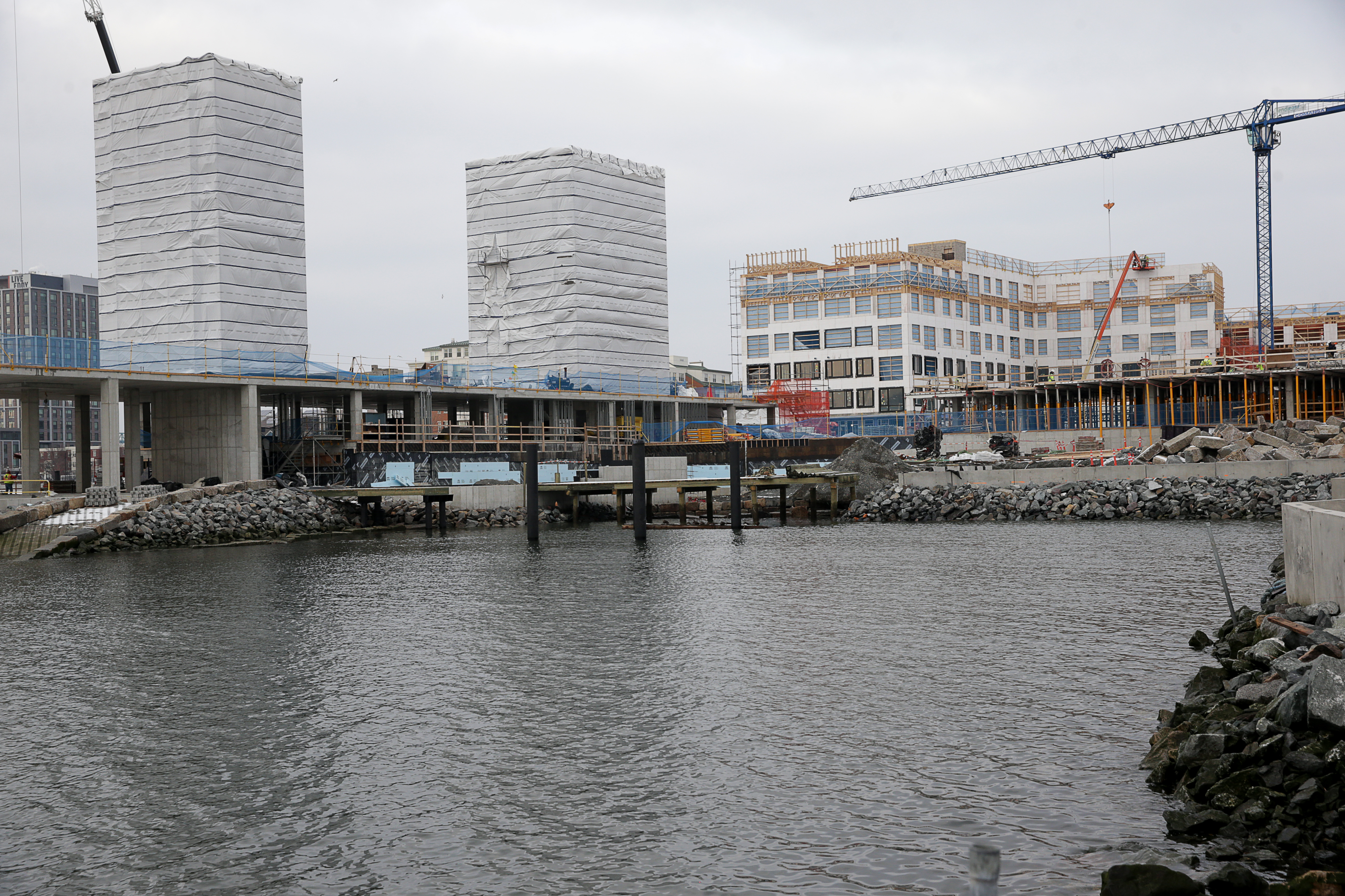 Clippership Wharf is one of a number of projects rising along the harbor.