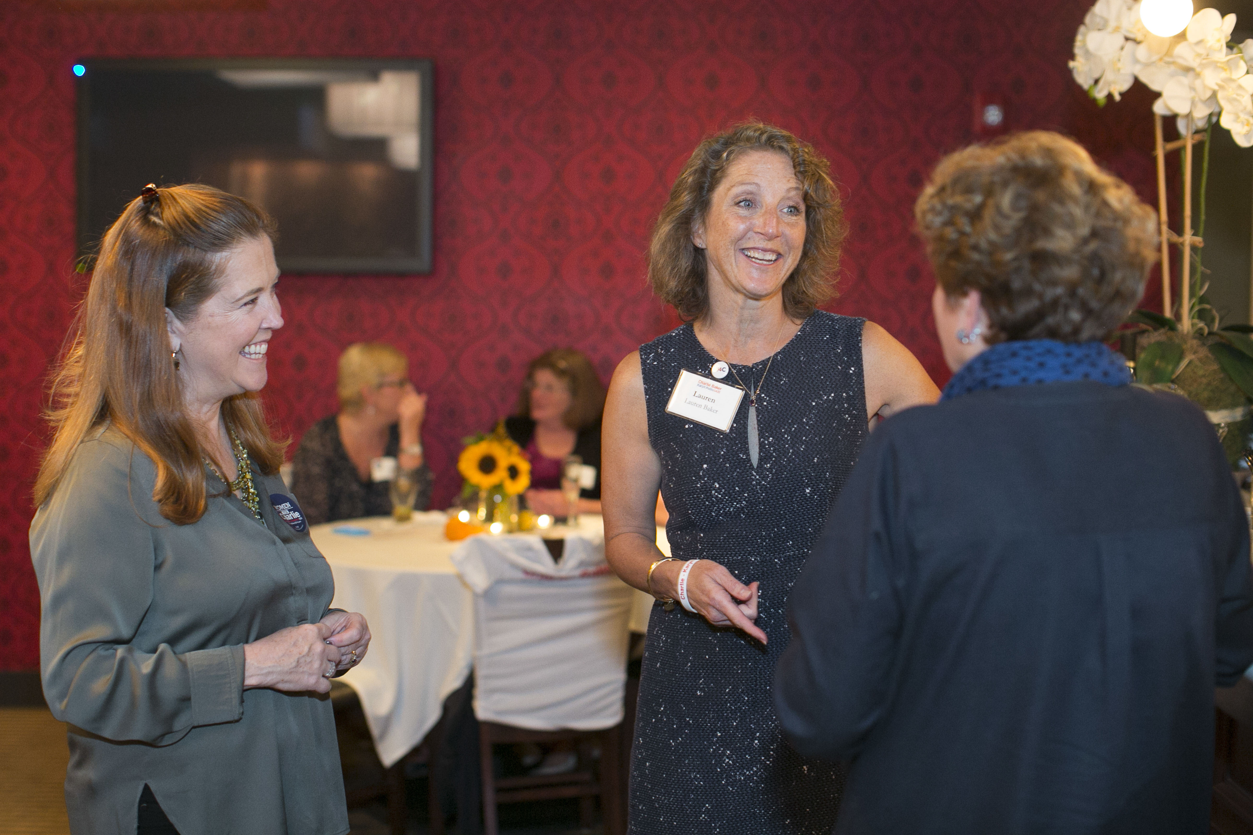 At the Women for Charlie meet-and-greet event, Baker chatted with Eleanor Greene (left) and Karen Hickman.