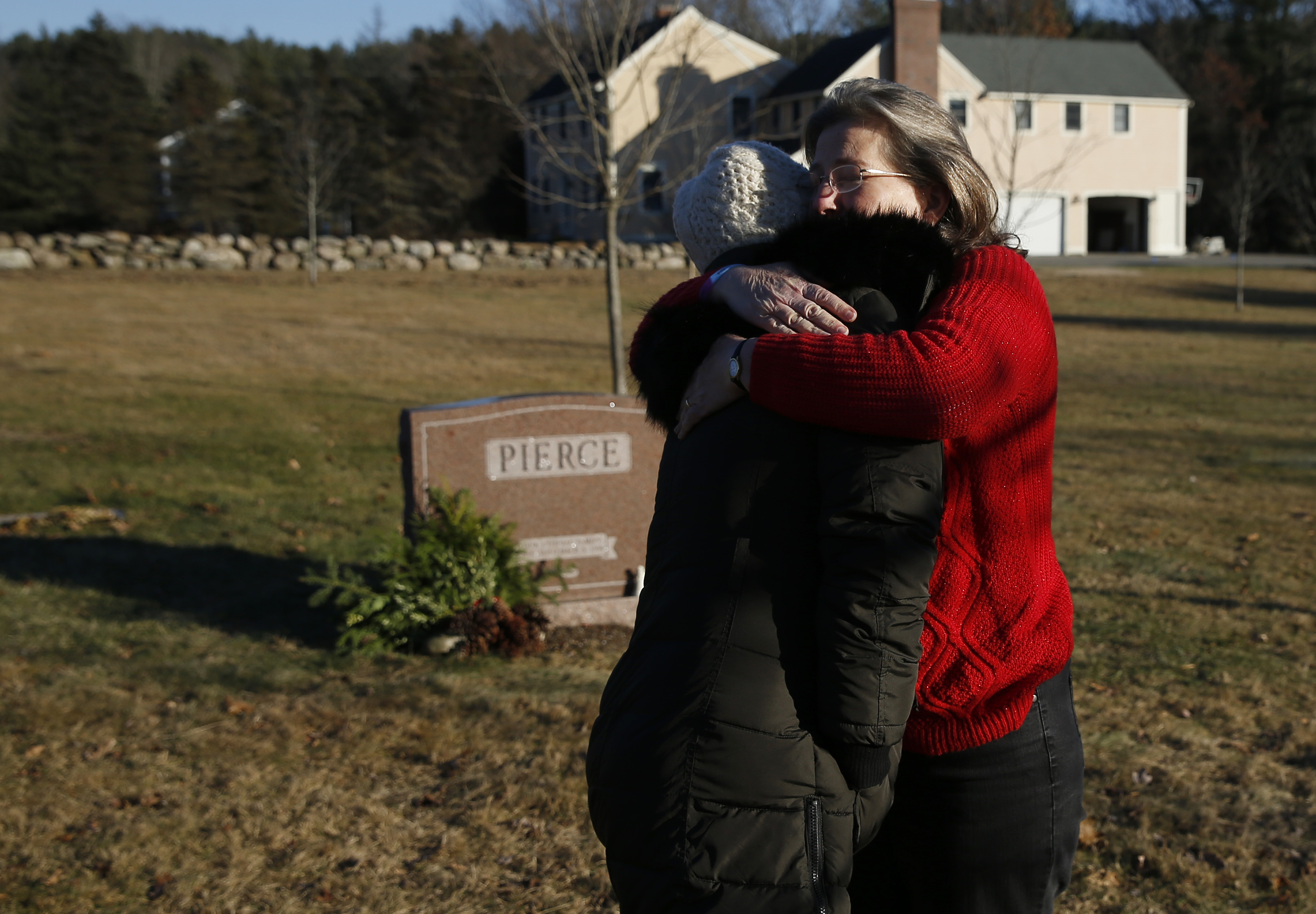 Cynthia Pierce (right) and Shannon Goyette visited Matthew Pierce’s grave. Hundreds of students paid their respects after his death.