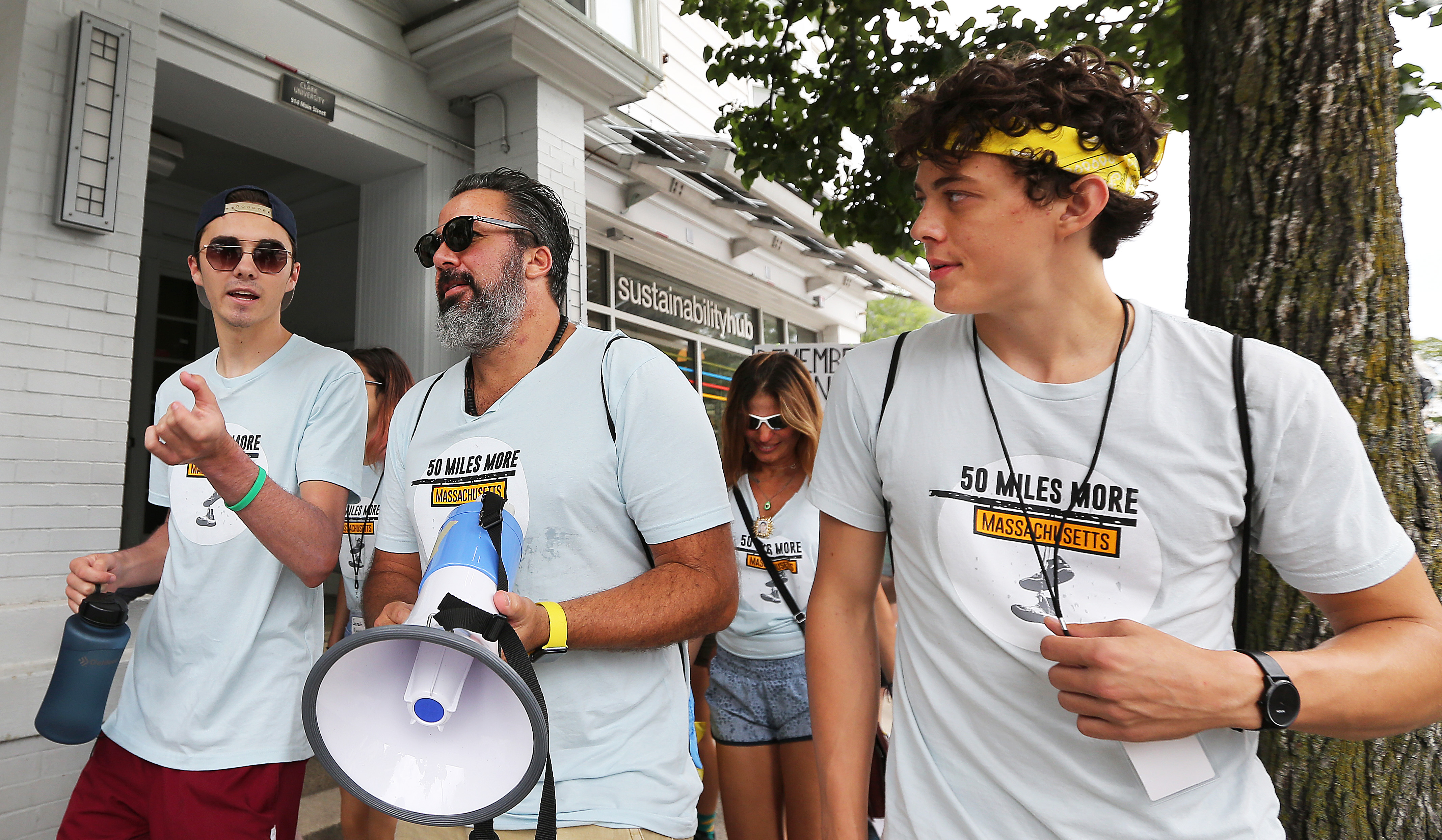 Along the walk, Hogg — wearing gym shorts, a backwards cap, and a “50 Miles More” shirt — talked with the Massachusetts students about how to best argue their platform in advance of the November midterms.