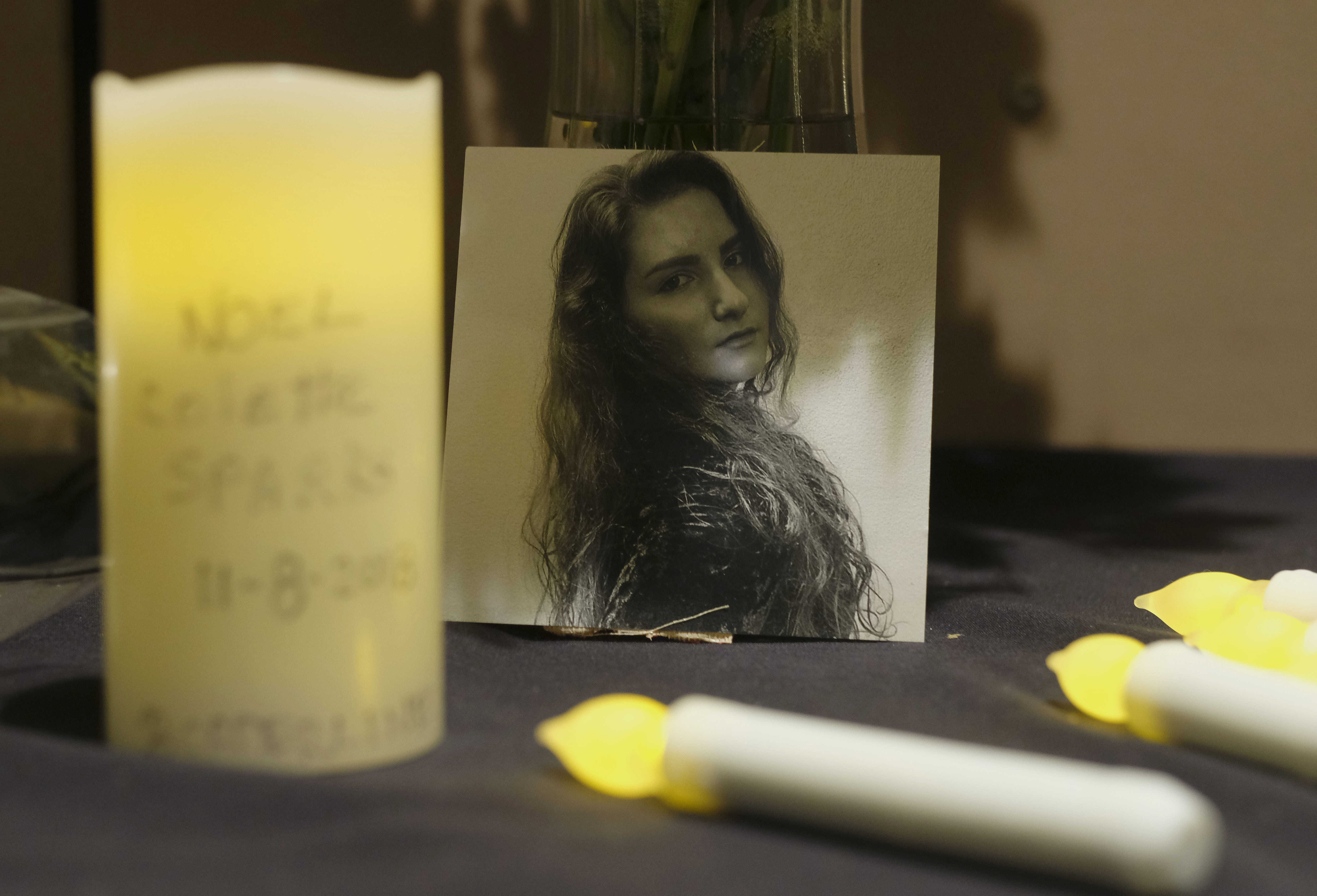 A picture of one of victims of the mass shooting is seen during a candlelight vigil in Thousand Oaks, Calif., Thursday.