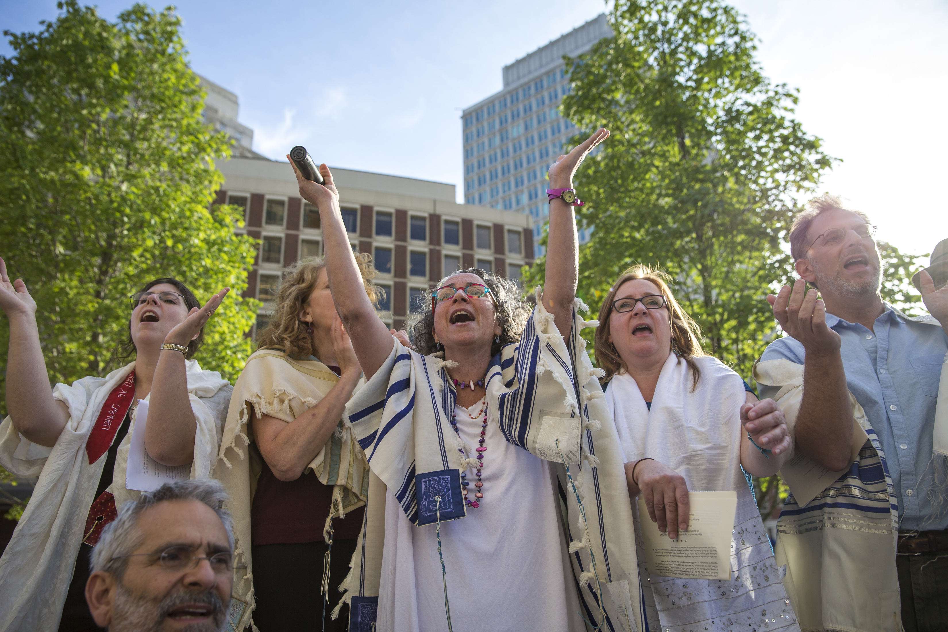 Clockwise, from upper left: Cantor Vera Broekhuysen of Haverhill, Barbara Penzner of West Roxbury, Claudia Kreiman of Brookline, Robin Sparr of Lowell, and Andrew Vogel of Brookline sang in prayer.