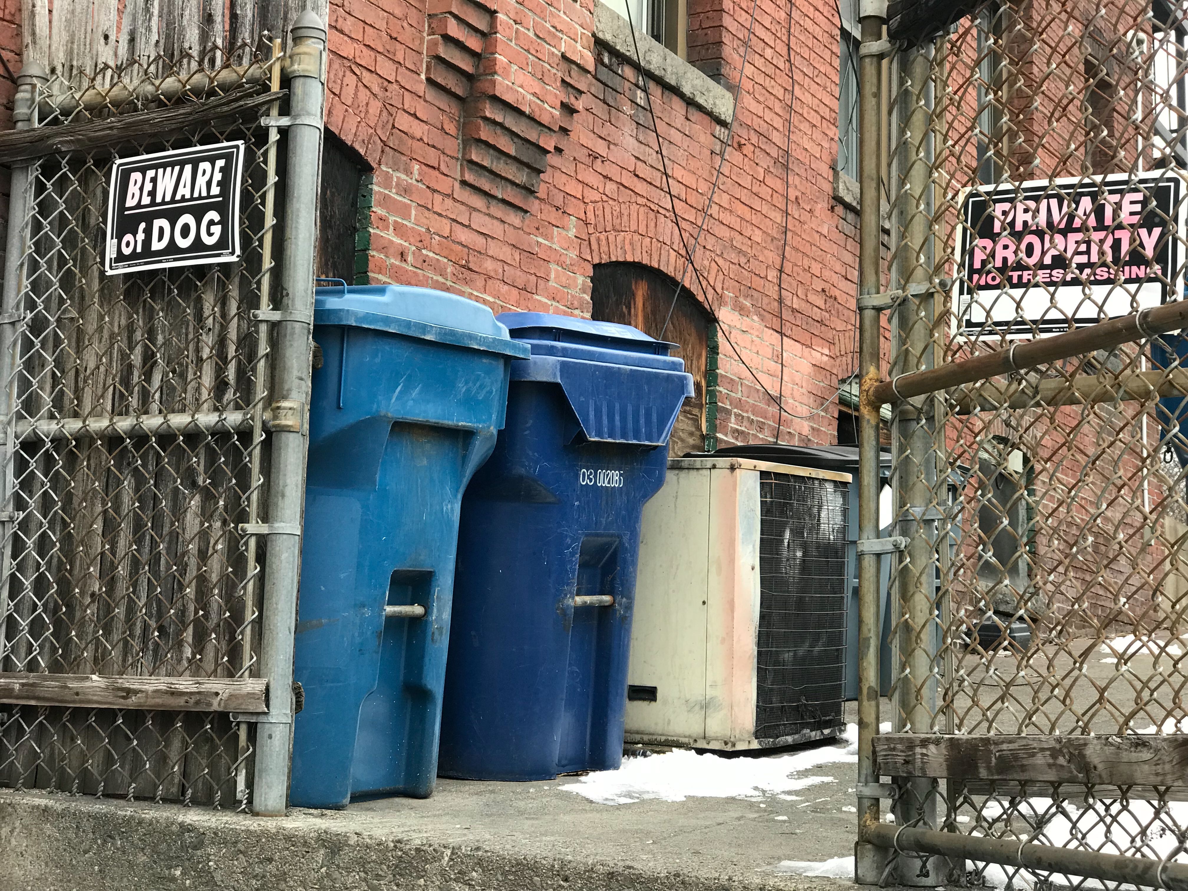Chain link fence in Worcester with a BEWARE OF DOG sign.