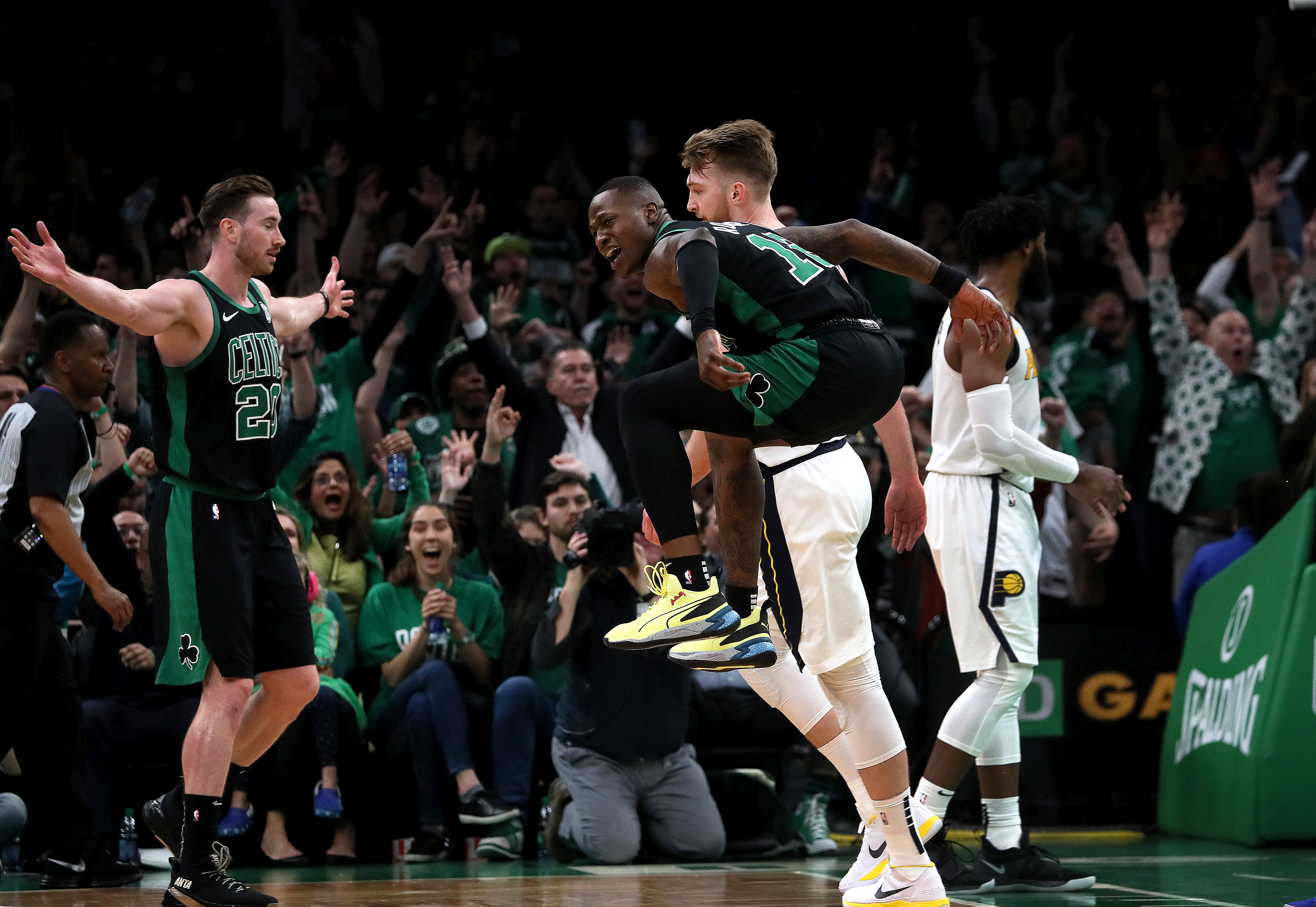 The Celtics’ Terry Rozier jumps for joy after hitting a 3-pointer at the buzzer to end the third quarter.
